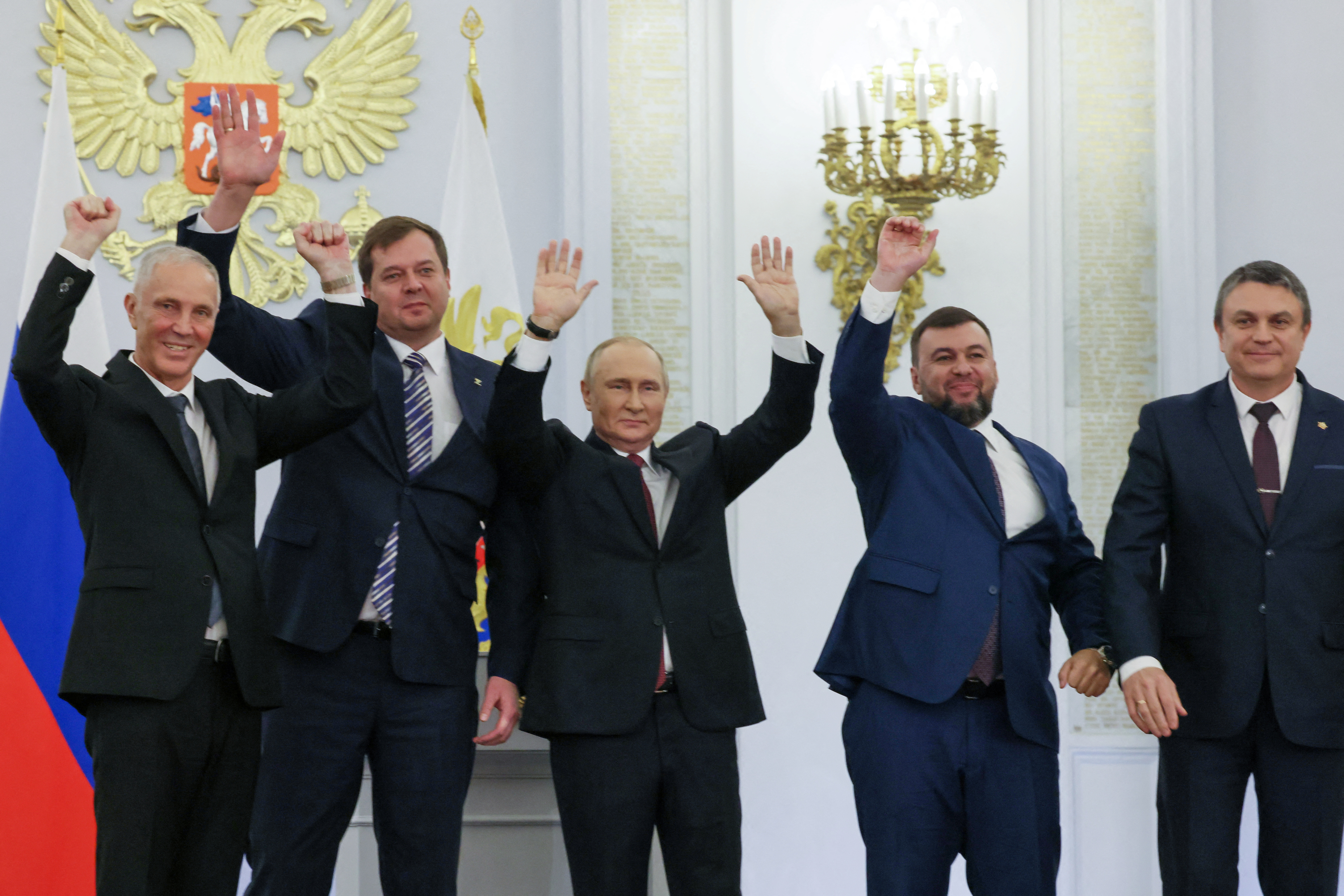 Russian President Vladimir Putin and Denis Pushilin, Leonid Pasechnik, Vladimir Saldo, Yevgeny Balitsky, who are the Russian-installed leaders in Ukraine's Donetsk, Luhansk, Kherson and Zaporizhzhia regions, attend a ceremony to declare the annexation of the Russian-controlled territories of four Ukraine's Donetsk, Luhansk, Kherson and Zaporizhzhia regions, after holding what Russian authorities called referendums in the occupied areas of Ukraine that were condemned by Kyiv and governments worldwide, in the Georgievsky Hall of the Great Kremlin Palace in Moscow, Russia, September 30, 2022. Sputnik