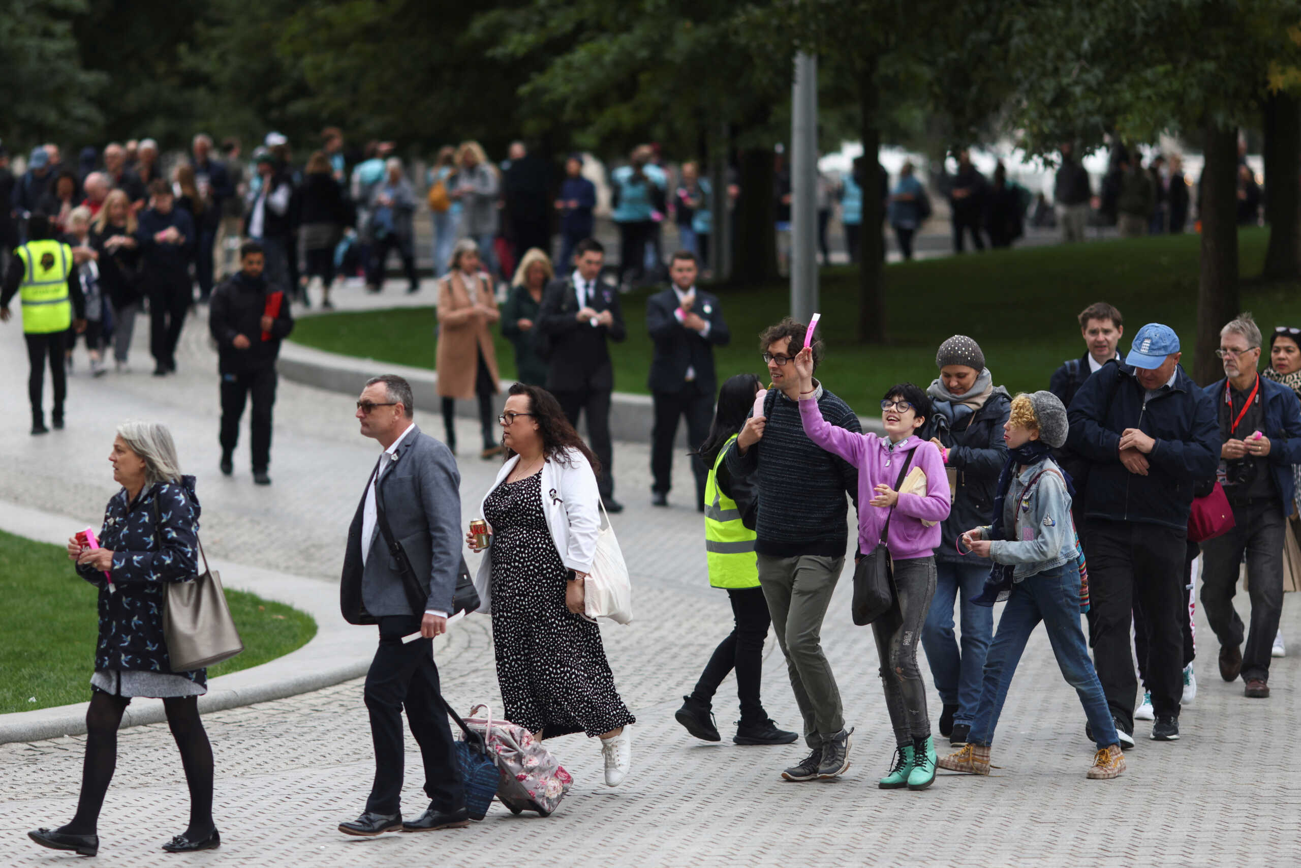 A person reacts in queue as people gather to pay respects to Britain's Queen Elizabeth following her death, in South Bank, London, Britain September 15, 2022. REUTERS