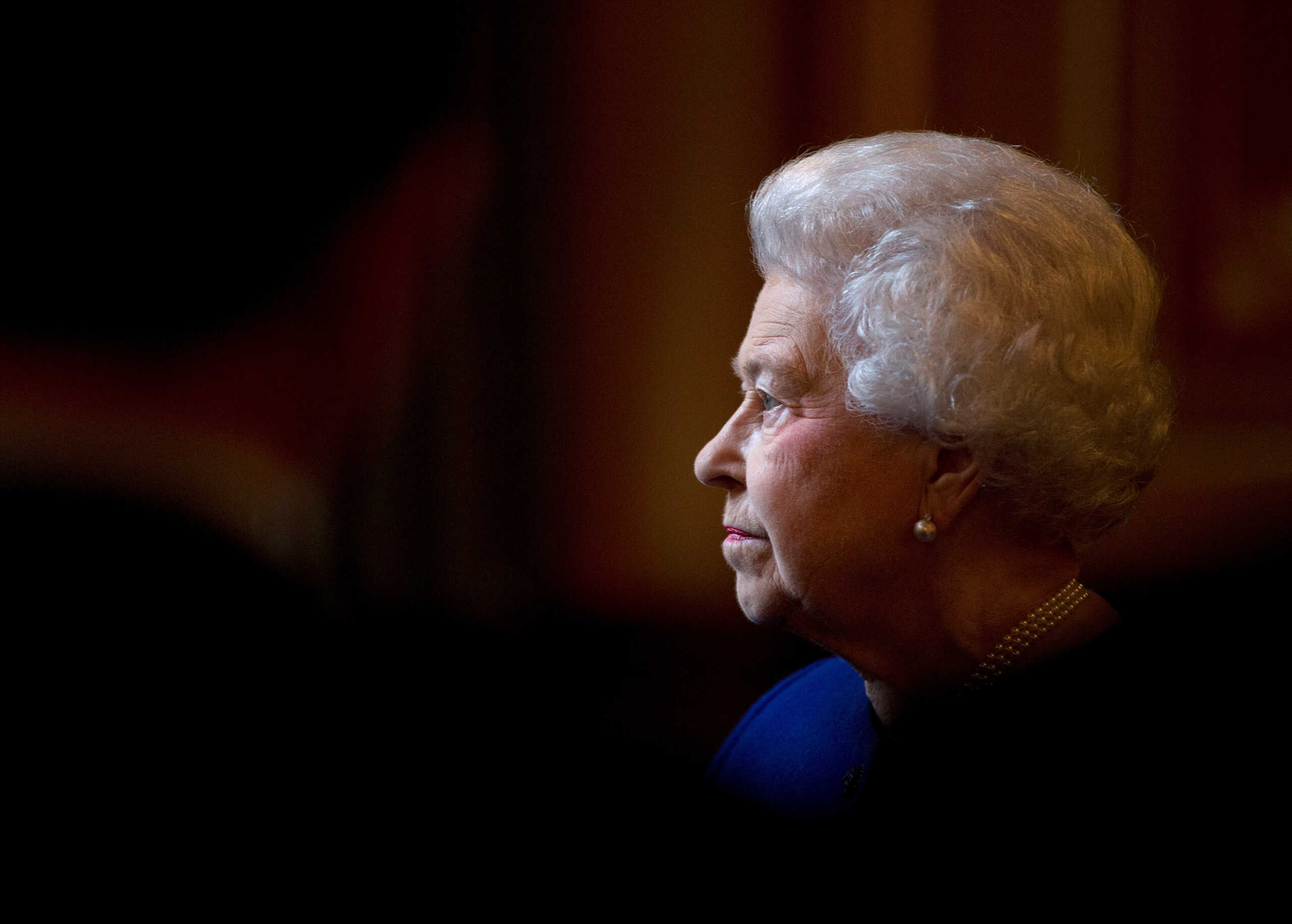 FILE PHOTO: Britain's Queen Elizabeth tours the Foreign and Commonwealth Office during a visit to mark her Diamond Jubilee, London, Britain, December 18, 2012.     REUTERS