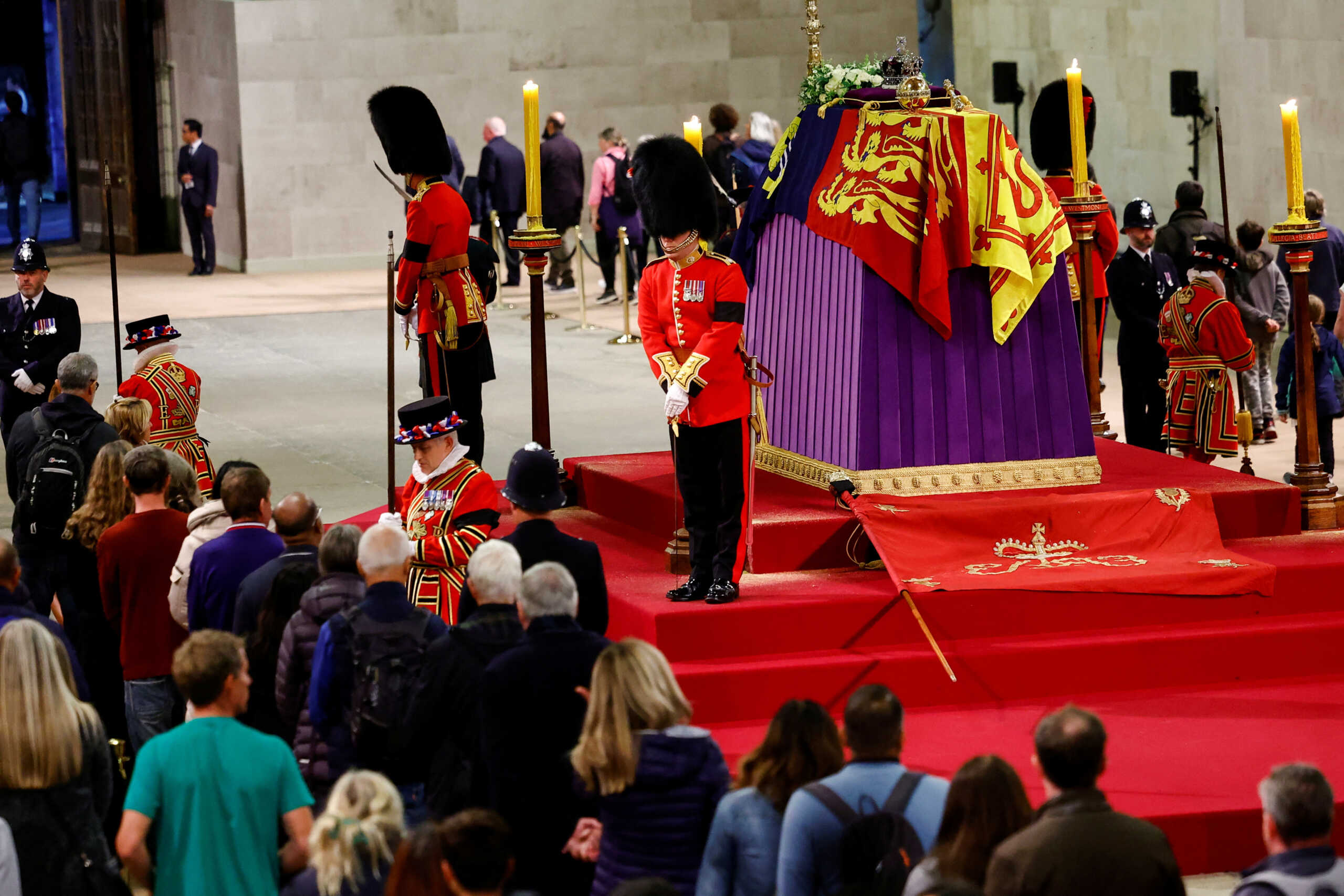 Royal guards stand by the coffin of Britain's Queen Elizabeth as members of the public pay their respects, following her death, during her lying-in-state at Westminster Hall, in London, Britain, September 18, 2022. REUTERS