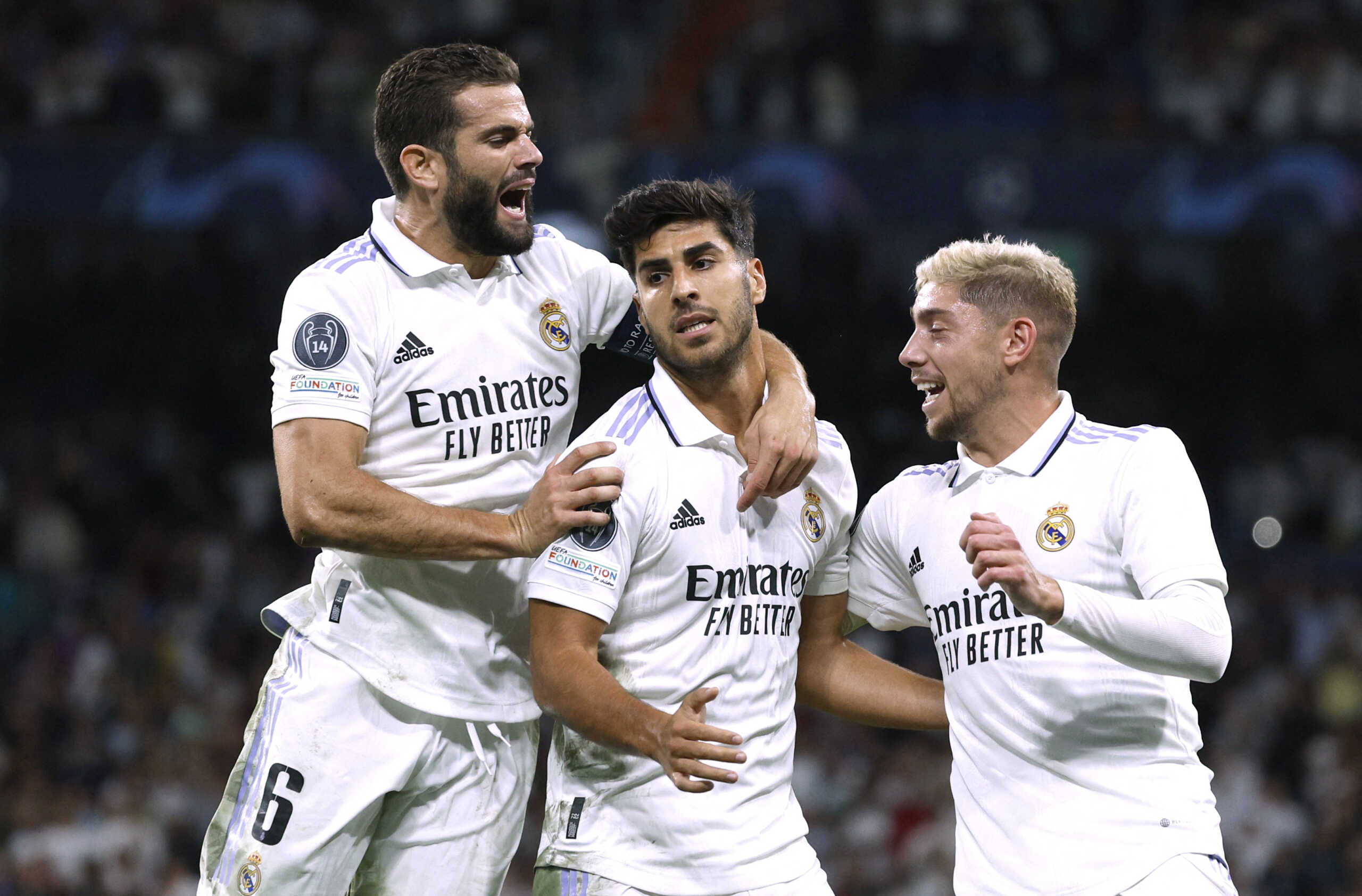Soccer Football - Champions League - Group F - Real Madrid v RB Leipzig - Santiago Bernabeu, Madrid, Spain - September 14, 2022 Real Madrid's Marco Asensio celebrates scoring their second goal with teammates REUTERS