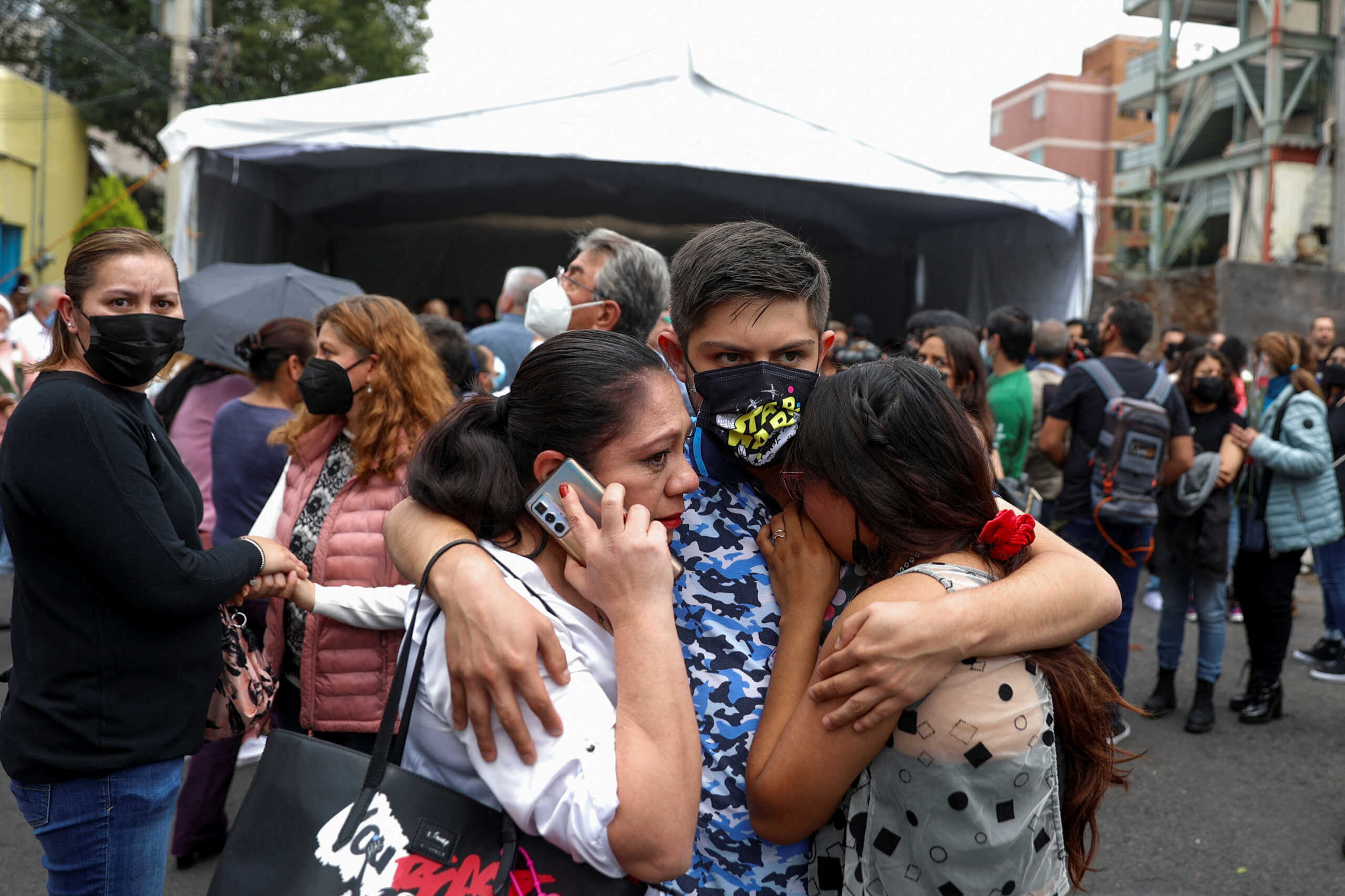 People react after an earthquake, in Mexico City, Mexico, September 19, 2022. REUTERS
