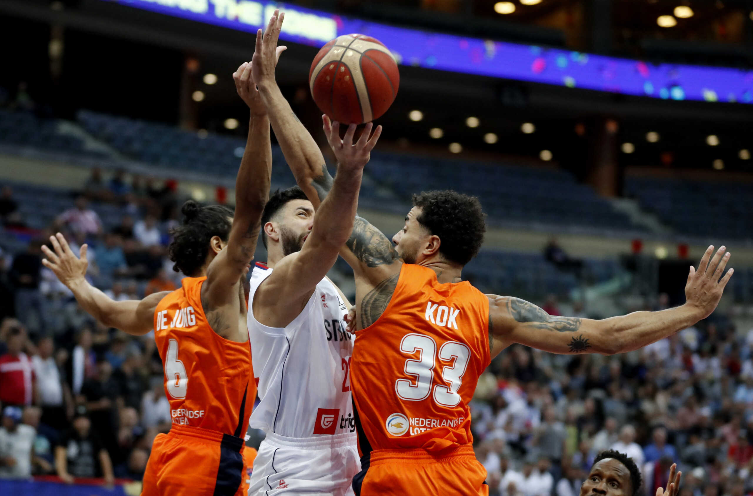 Basketball - EuroBasket Championship - Group D - Serbia v Netherlands - Prague Arena, Prague, Czech Republic - September 2, 2022 Serbia's Vasilije Micic in action with Netherlands' Worthy De Jong and Jito Kok REUTERS