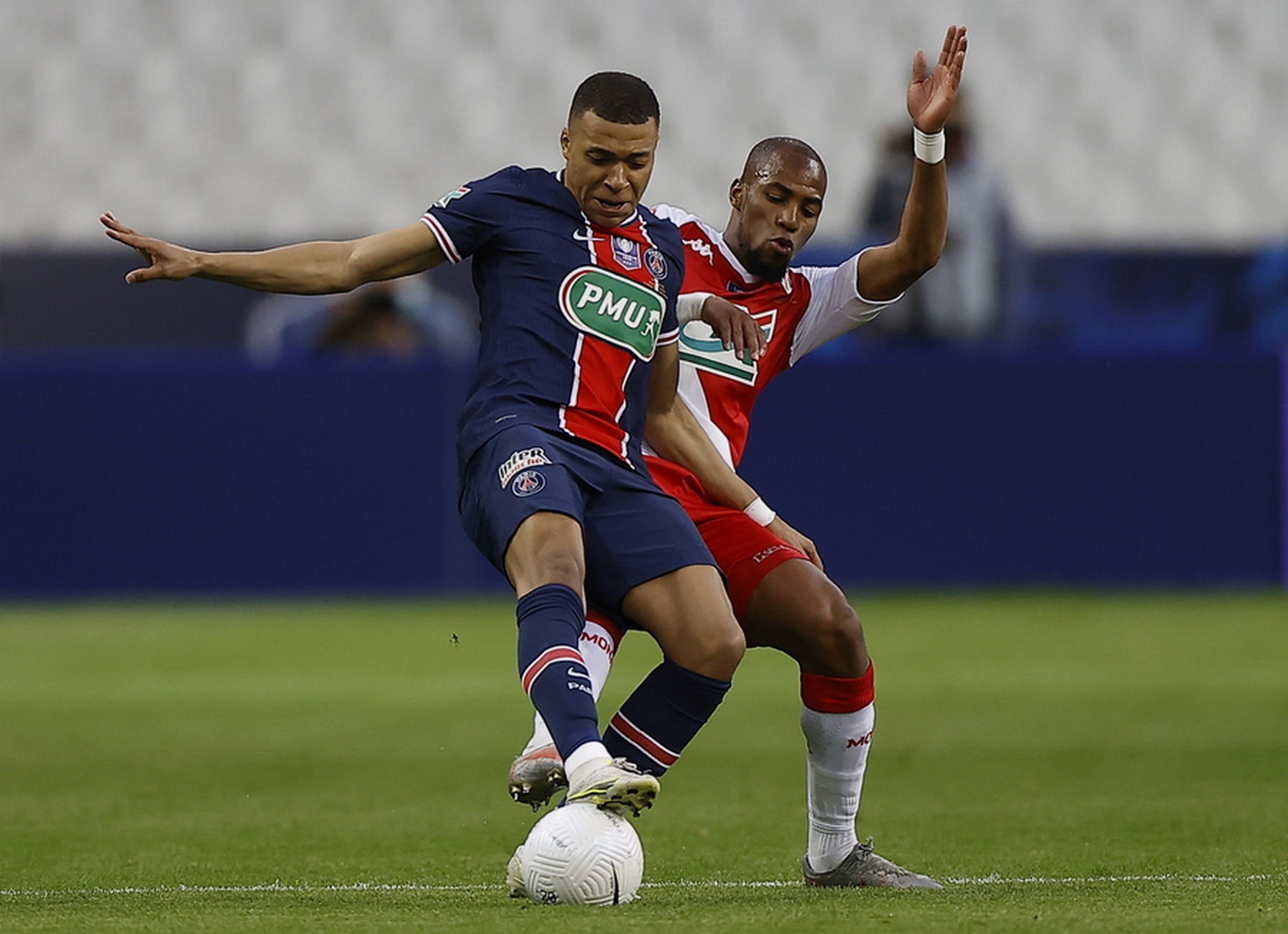 epa09213569 AS Monaco's Djibril Sidibe (R) and Paris Saint Germain's Kylian Mbappe in action during the Coupe de France final soccer match between AS Monaco and Paris Saint Germain, in Saint-Denis, France, 19 May 2021.  EPA