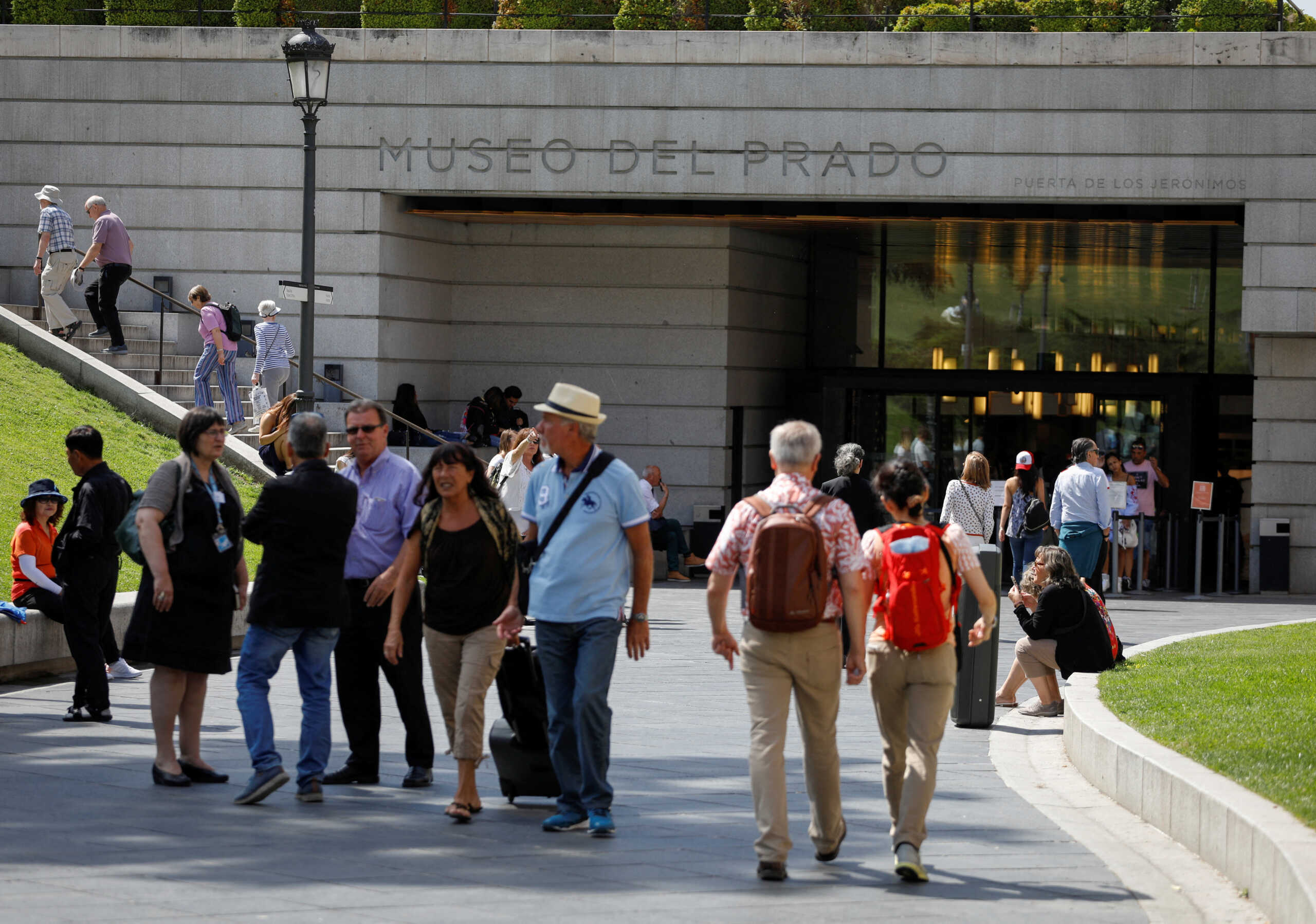 FILE PHOTO: People walk near the entrance to the Prado Museum in Madrid, Spain, June 14, 2018.  REUTERS