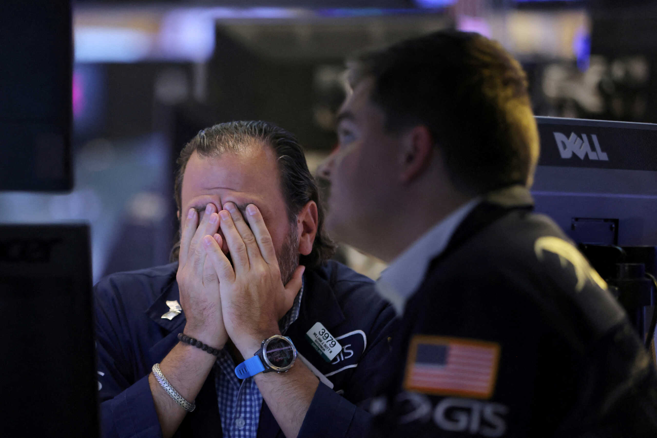 FILE PHOTO: Traders work on the trading floor at the New York Stock Exchange (NYSE) in Manhattan, New York City, U.S., September 13, 2022. REUTERS