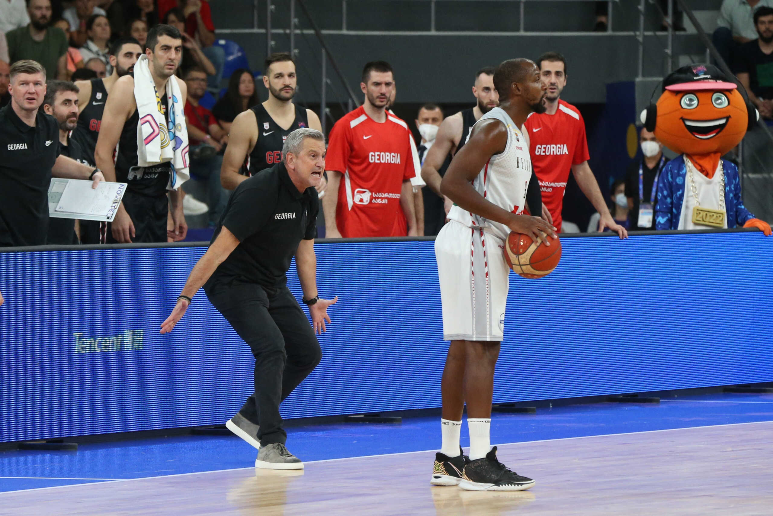 Basketball - EuroBasket Championship - Group A - Belgium v Georgia - Tbilisi Arena, Tbilisi, Georgia - September 1, 2022 Belgium's Jonathan Tabu in action as Georgia coach Ilias Zouros reacts REUTERS