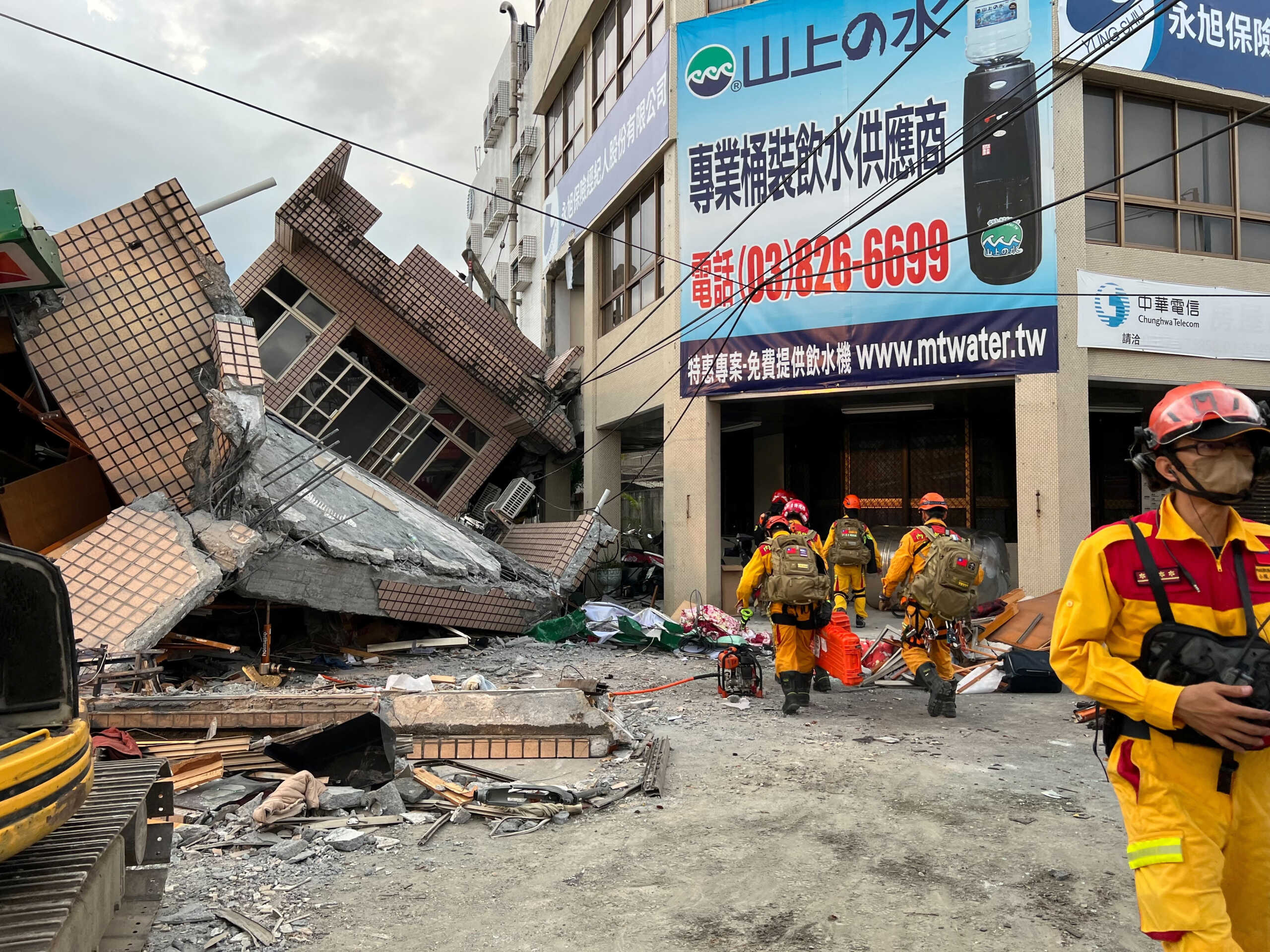Firefighters work at the site where a building collapsed following a 6.8-magnitude earthquake, in Yuli, Hualien county, Taiwan September 18, 2022. Taiwan's 0918 Earthquake Central Emergency Operations Centre