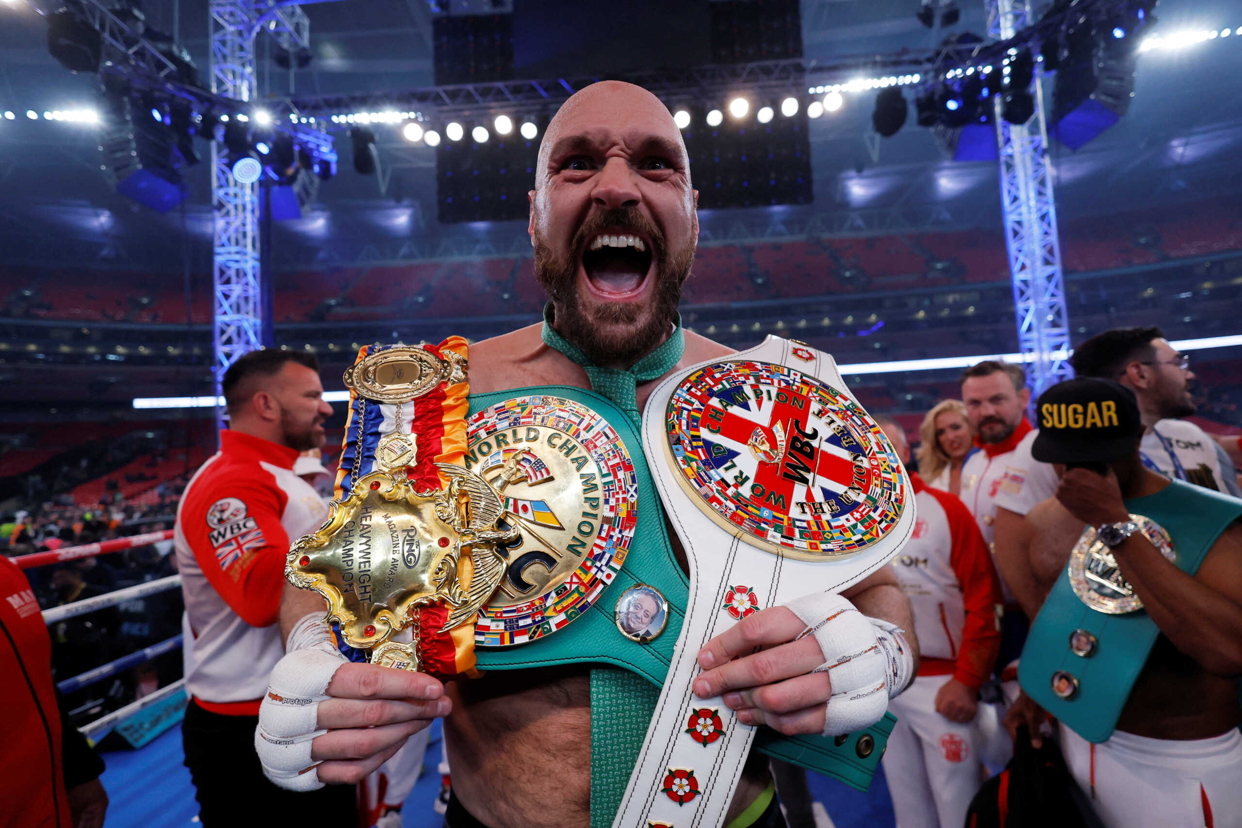 FILE PHOTO: Boxing - Tyson Fury v Dillian Whyte - WBC World Heavyweight Title - Wembley Stadium, London, Britain - April 23, 2022  Tyson Fury celebrates with the belts after winning his fight against Dillian Whyte Action Images via Reuters