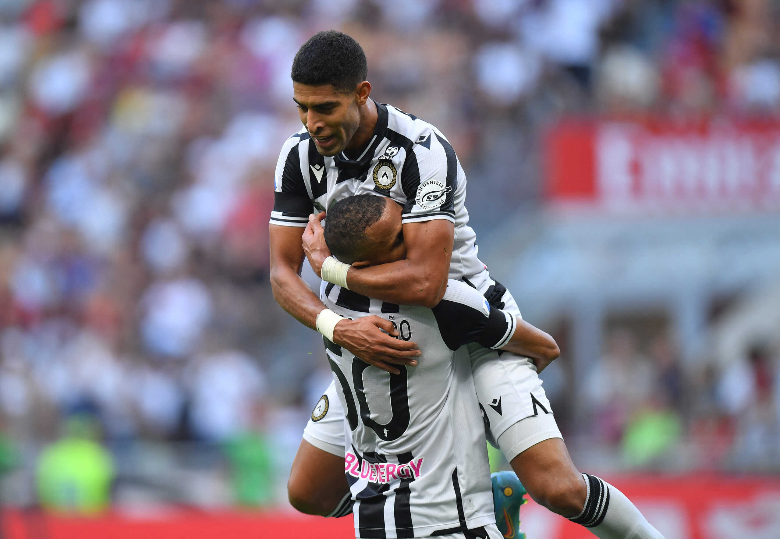 Soccer Football - Serie A - AC Milan v Udinese - San Siro, Milan, Italy - August 13, 2022  Udinese's Adam Masina celebrates scoring their second goal with Rodrigo Becao REUTERS