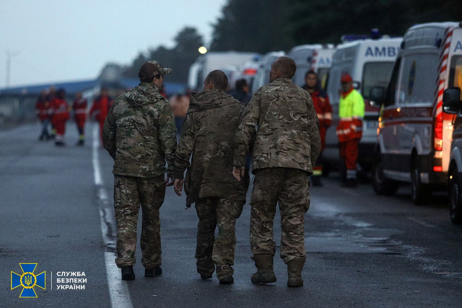 Ukrainian prisoners of war (POWs) walk after a swapping, amid Russia's attack on Ukraine, in Chernihiv region, Ukraine, in this handout picture released September 22, 2022. Press Service of the State Security Service of Ukraine