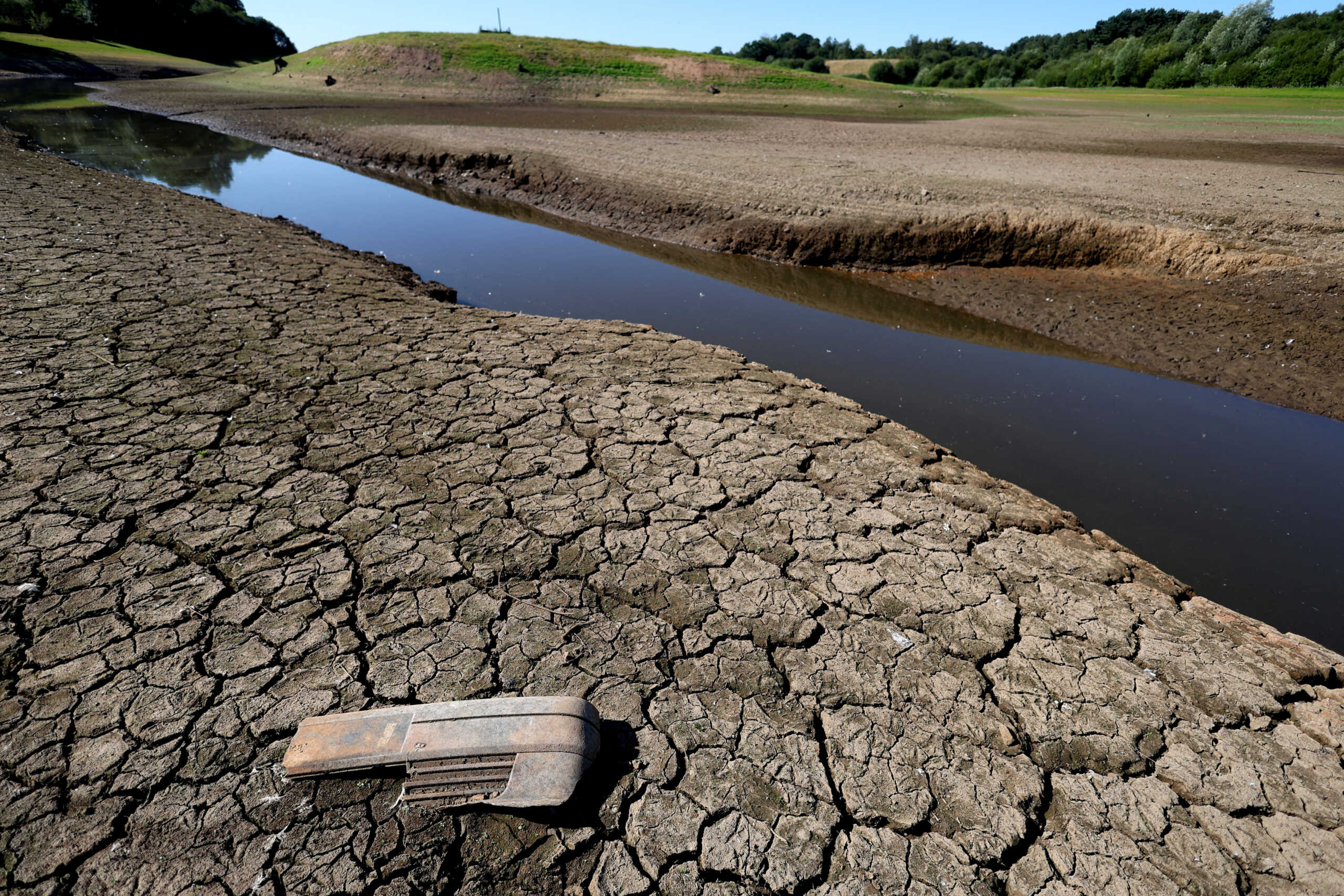 FILE PHOTO: Cracks can be seen in the dried up bed of Tittesworth Reservoir, in Leek, Britain, August 12, 2022.  REUTERS