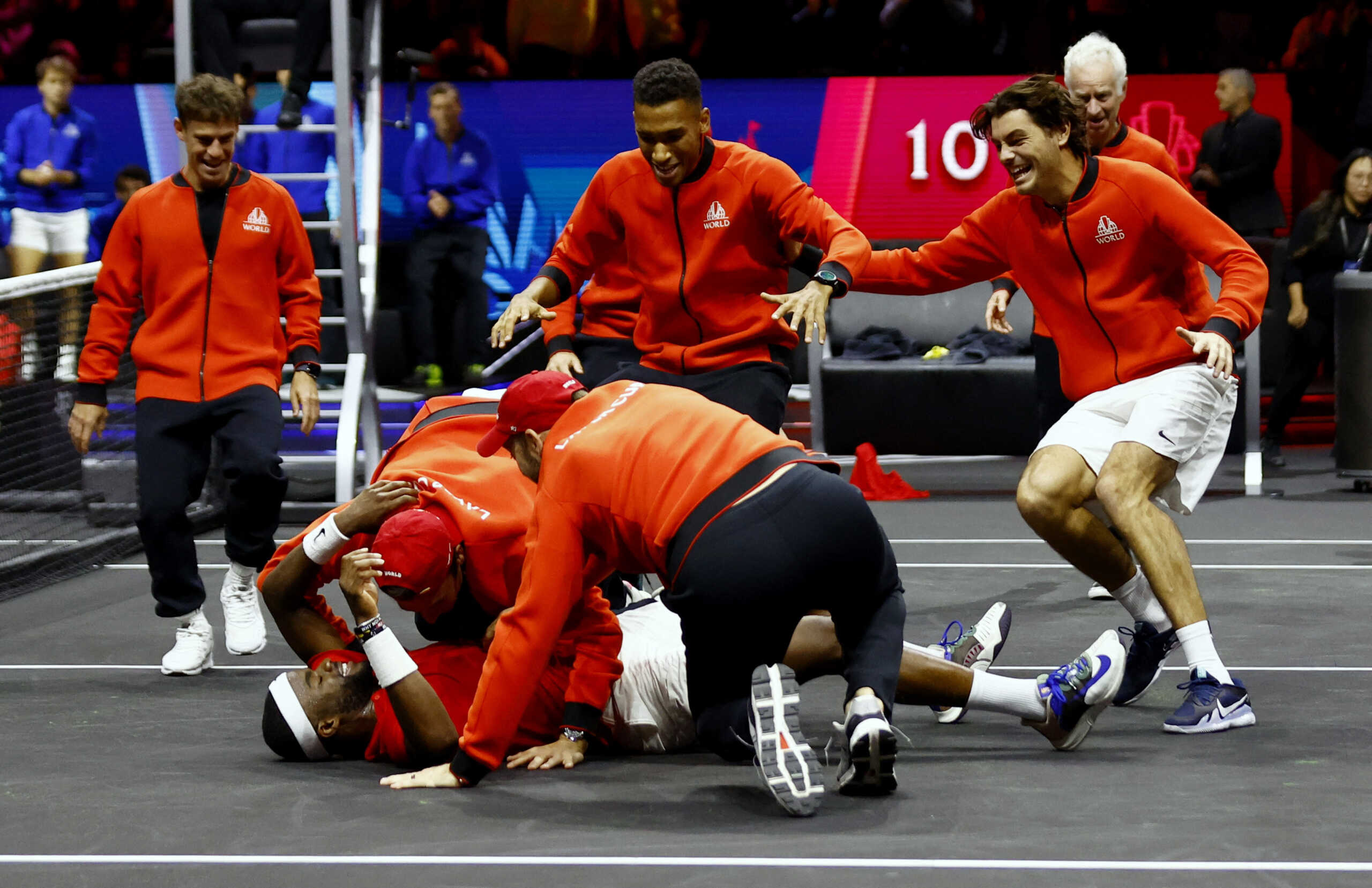 Tennis - Laver Cup - 02 Arena, London, Britain - September 25, 2022 Team World's Frances Tiafoe celebrates with teammates after winning his match and the Laver Cup against Team Europe's Stefanos Tsitsipas Action Images via Reuters