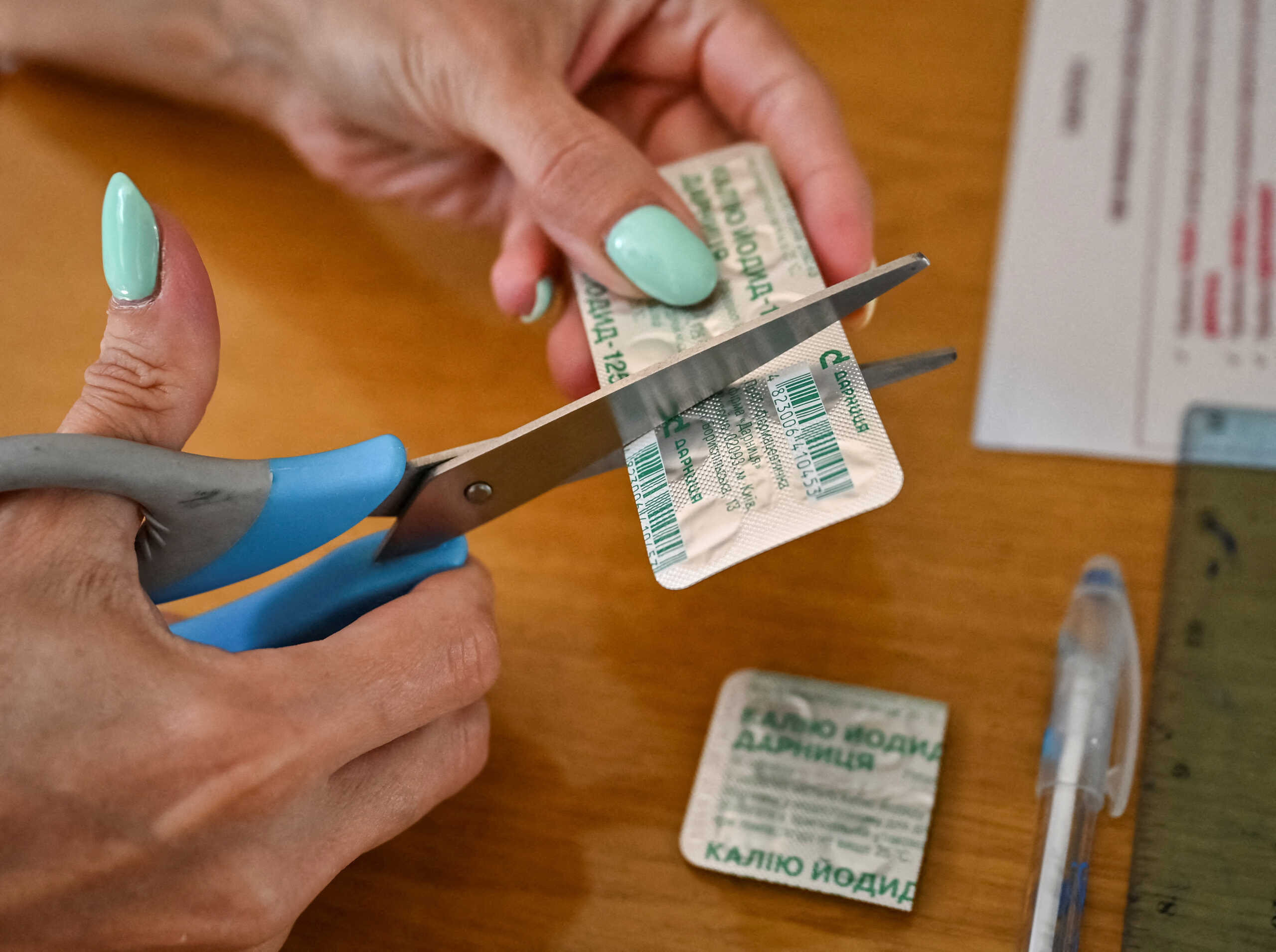 A medical worker prepares iodine tablets for Zaporizhzhia residents at the local administration office in the city's eastern Khortytskyi district as fears of a nuclear accident at Europe's largest nuclear power plant in currently occupied by Russia Enerhodar city, remain high, as Russia's attack on Ukraine continues, in Zaporizhzhia, Ukraine August 29, 2022.  REUTERS