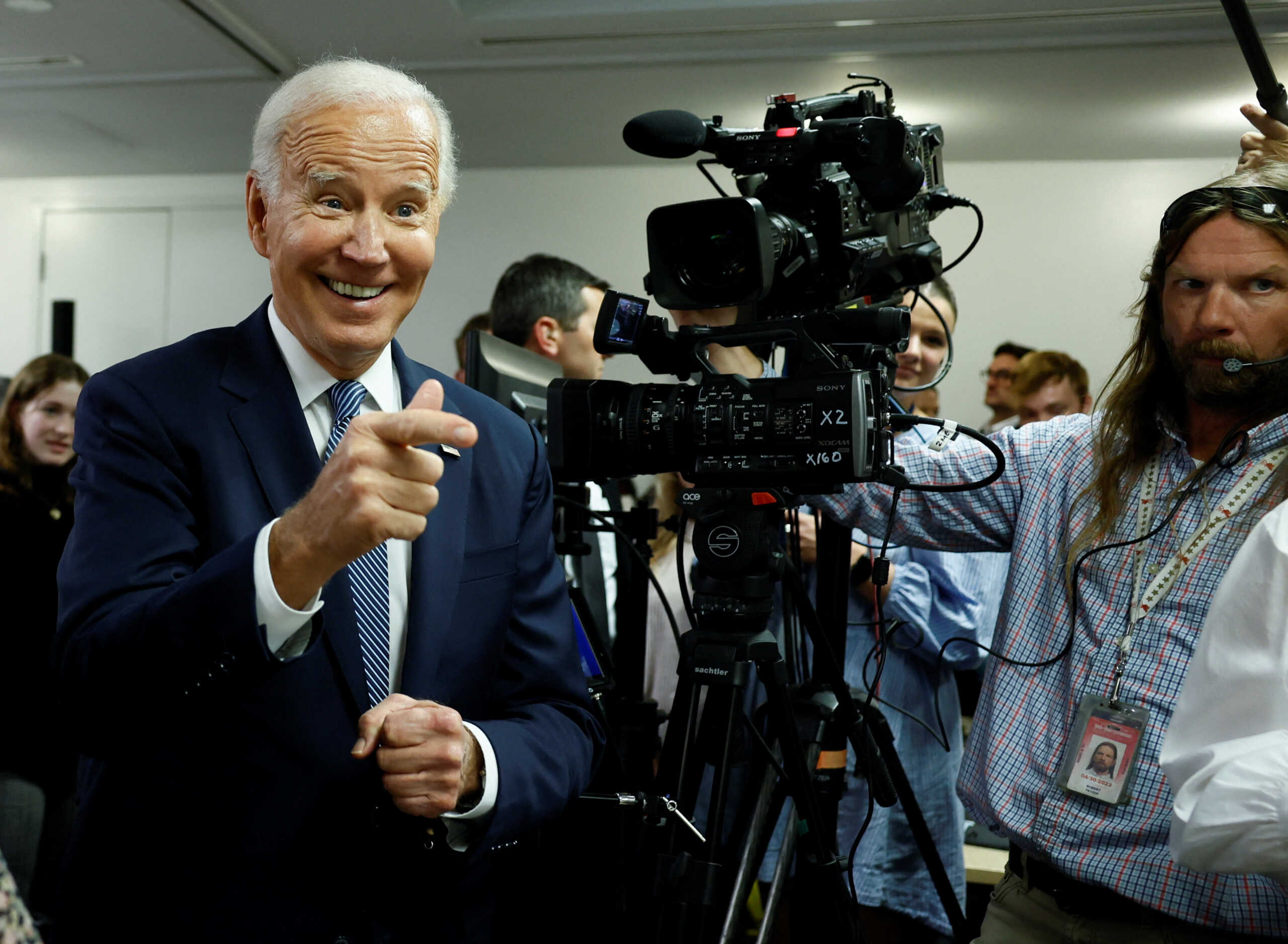 U.S. President Joe Biden laughs at the Democratic National Committee Headquarters ahead of the U.S. mid-term elections, in Washington, U.S., October 24, 2022. REUTERS