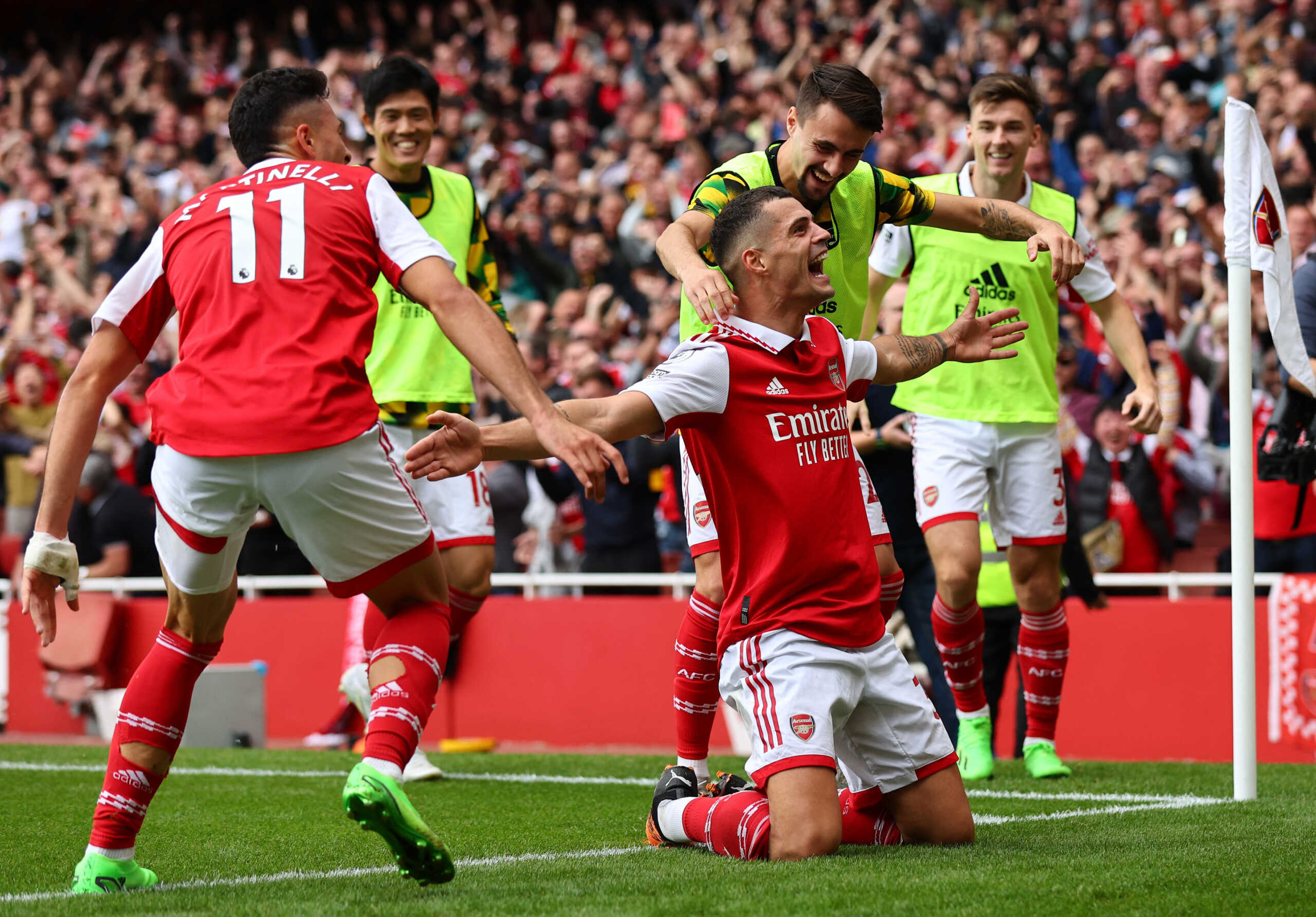 Soccer Football - Premier League - Arsenal v Tottenham Hotspur - Emirates Stadium, London, Britain - October 1, 2022 Arsenal's Granit Xhaka celebrates scoring their third goal with Fabio Vieira and Gabriel Martinelli REUTERS