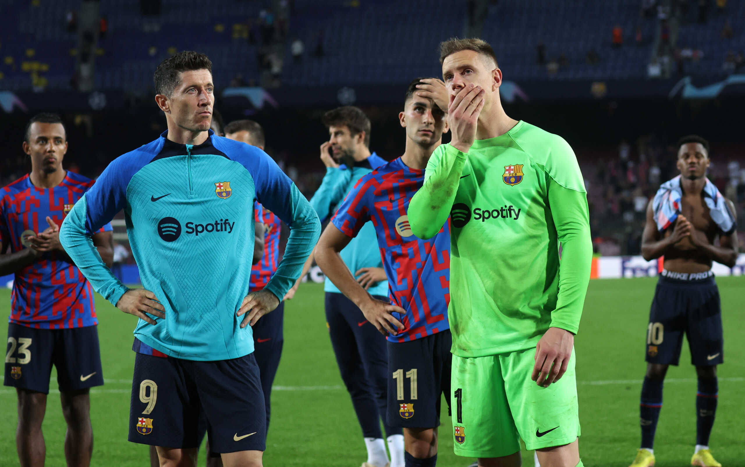 Soccer Football - Champions League - Group C - FC Barcelona v Bayern Munich - Camp Nou, Barcelona, Spain - October 26, 2022  FC Barcelona's Marc-Andre ter Stegen, Robert Lewandowski and Ferran Torres look dejected after being knocked out of the Champions League REUTERS