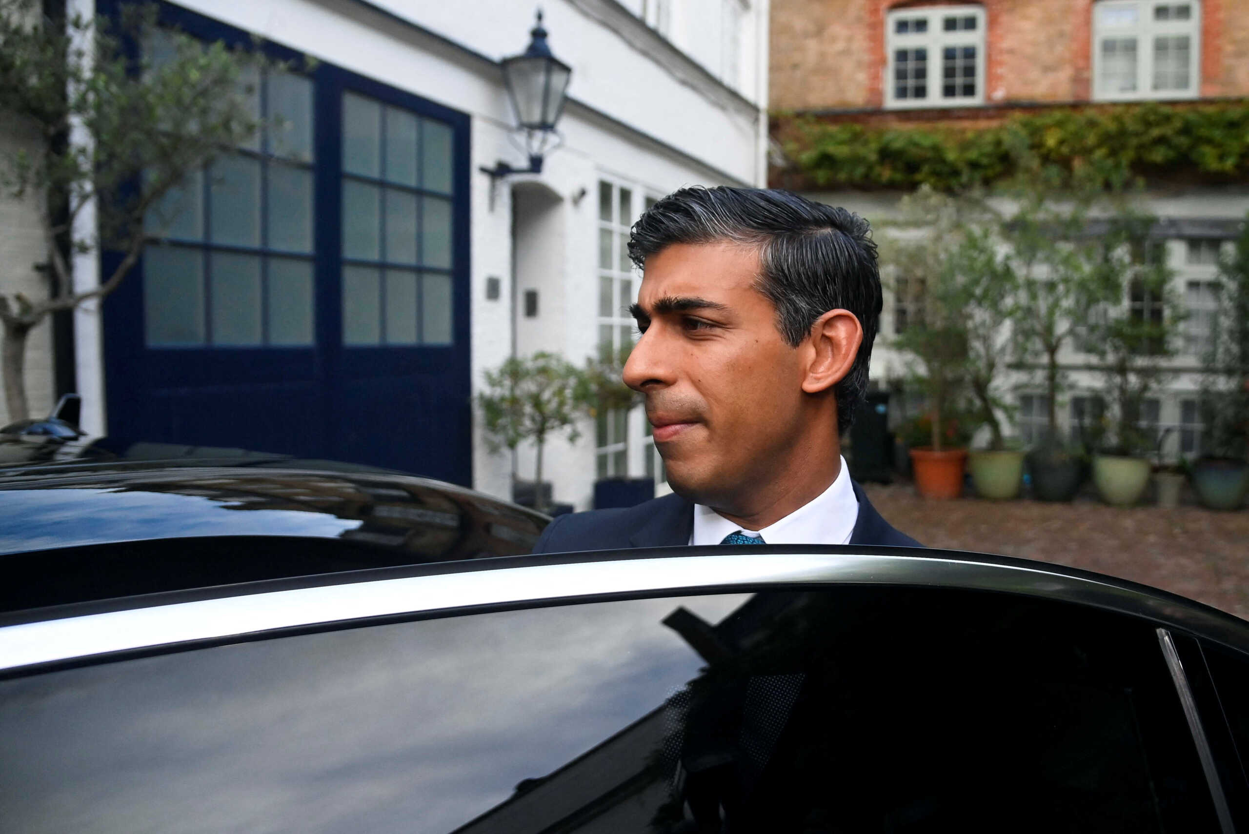 British Conservative MP Rishi Sunak leaves his home address in London, Britain, October 21, 2022. REUTERS