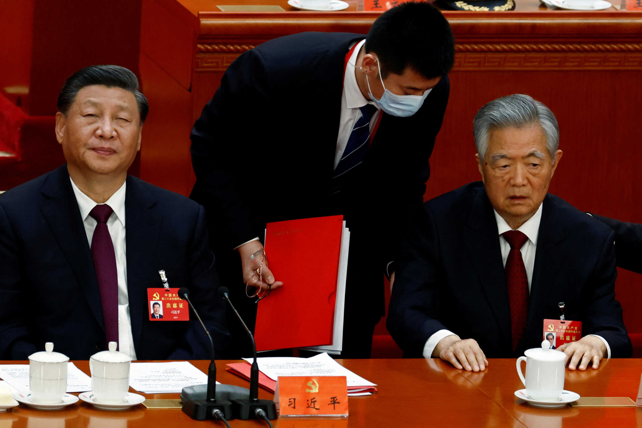 Chinese President Xi Jinping and former president Hu Jintao attend the closing ceremony of the 20th National Congress of the Communist Party of China, at the Great Hall of the People in Beijing, China October 22, 2022. REUTERS
