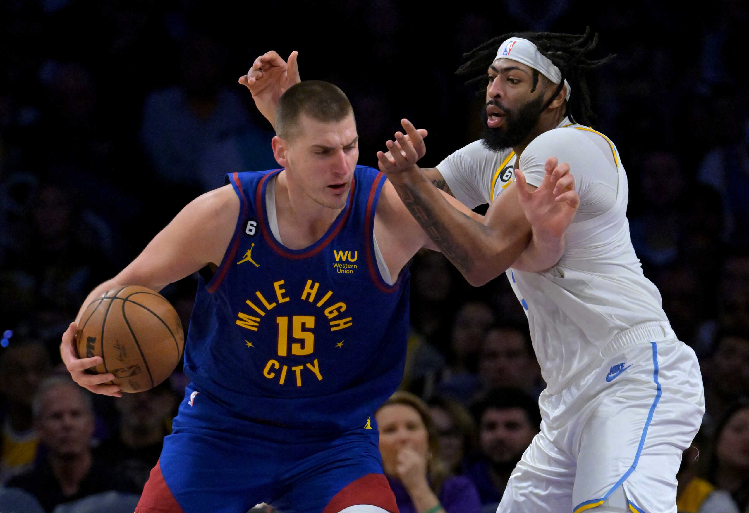 Oct 30, 2022; Los Angeles, California, USA; Denver Nuggets center Nikola Jokic (15) is guarded by Los Angeles Lakers forward Anthony Davis (3) in the second half at Crypto.com Arena. Mandatory Credit: Jayne Kamin-Oncea-USA TODAY Sports