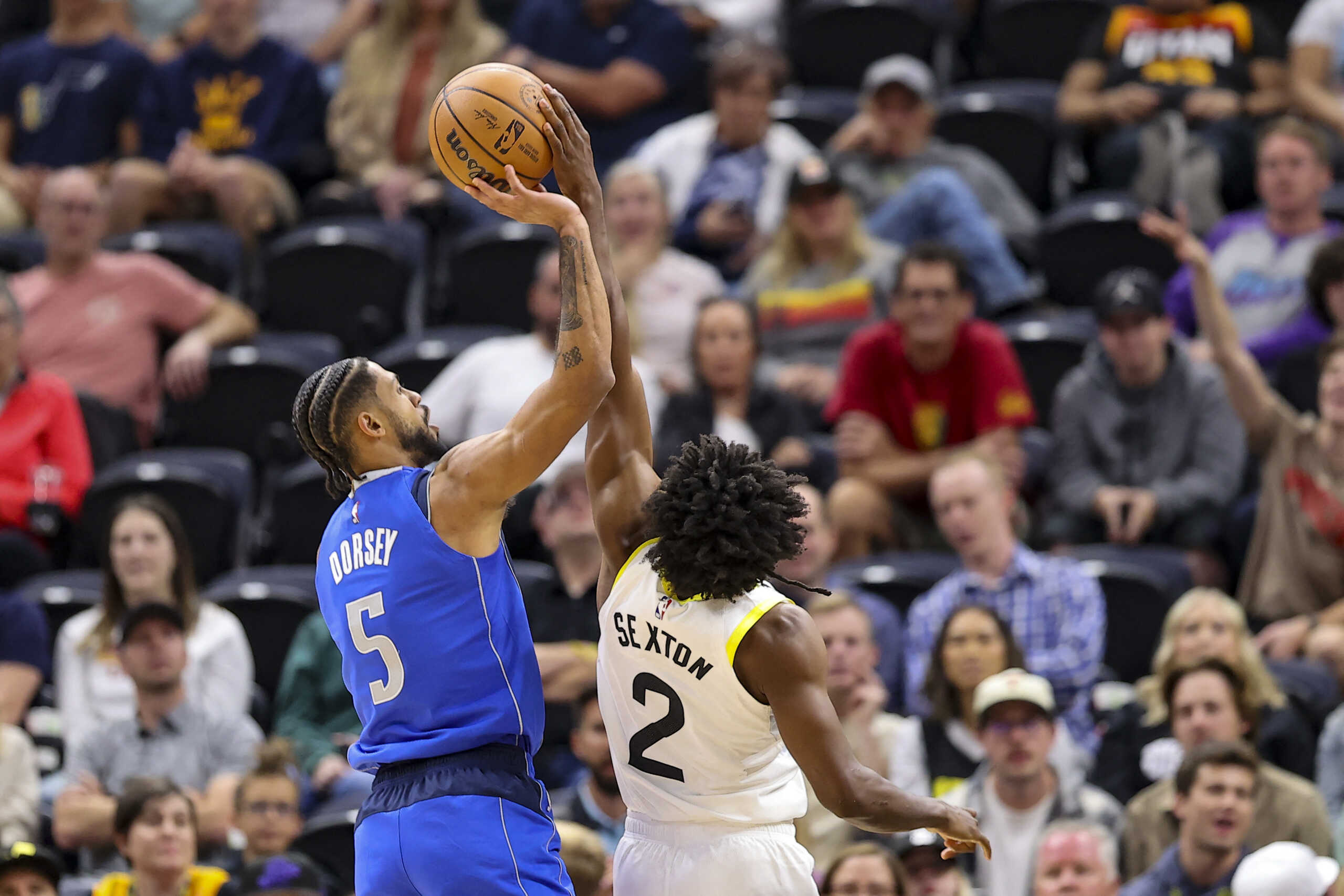 Oct 14, 2022; Salt Lake City, Utah, USA; Dallas Mavericks guard Tyler Dorsey (5) has a shot blocked by Utah Jazz guard Collin Sexton (2) in the fourth quarter at Vivint Arena. Mandatory Credit: Rob Gray-USA TODAY Sports