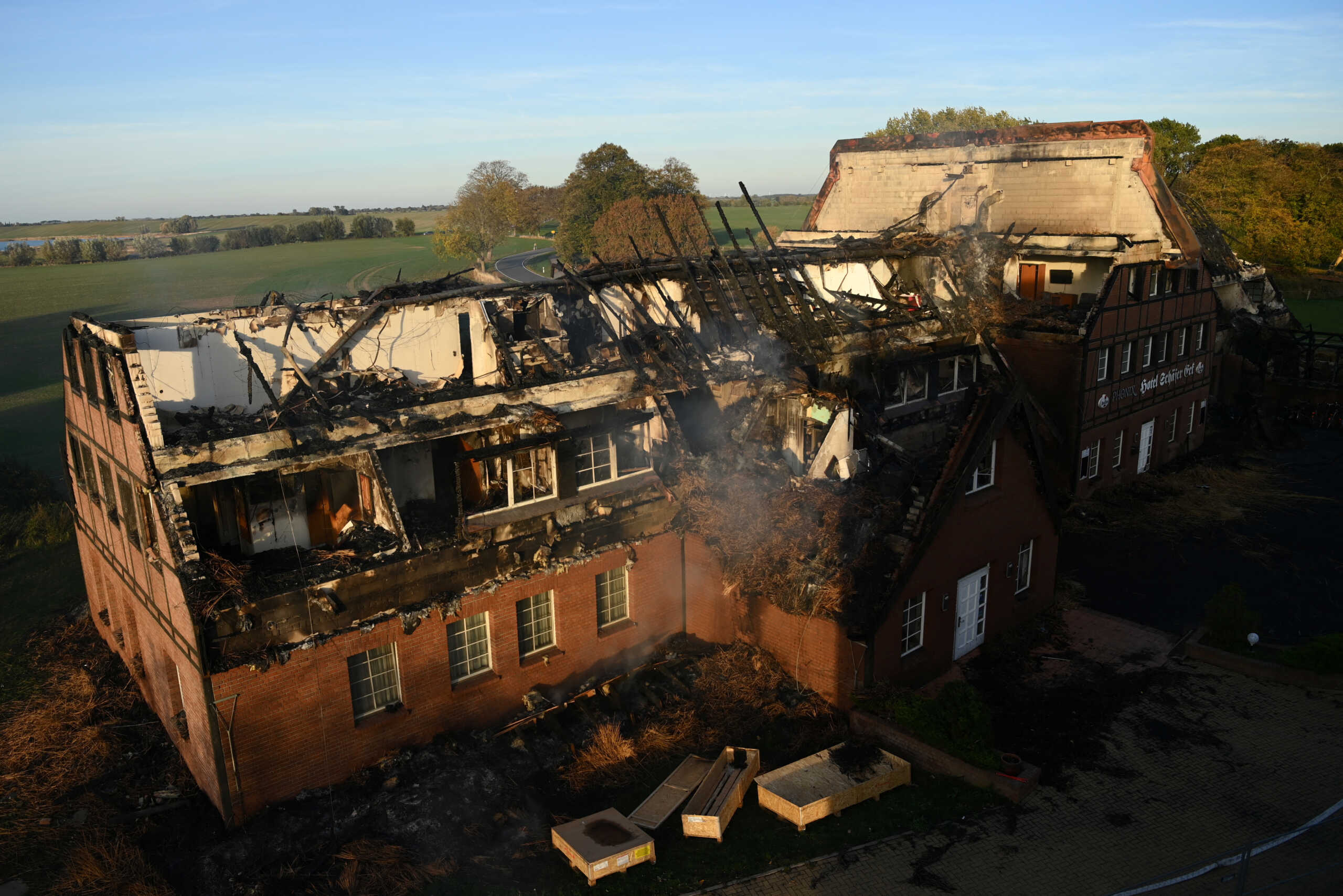 The remnants of a Red Cross home for Ukrainian refugees are seen following a fire in Gross Stroemkendorf near Wismar, Germany, October 20, 2022. REUTERS