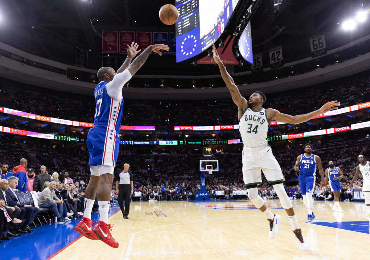 Oct 20, 2022; Philadelphia, Pennsylvania, USA; Philadelphia 76ers forward P.J. Tucker (17) shoots a three pointer past Milwaukee Bucks forward Giannis Antetokounmpo (34) during the first quarter at Wells Fargo Center. Mandatory Credit: Bill Streicher-USA TODAY Sports