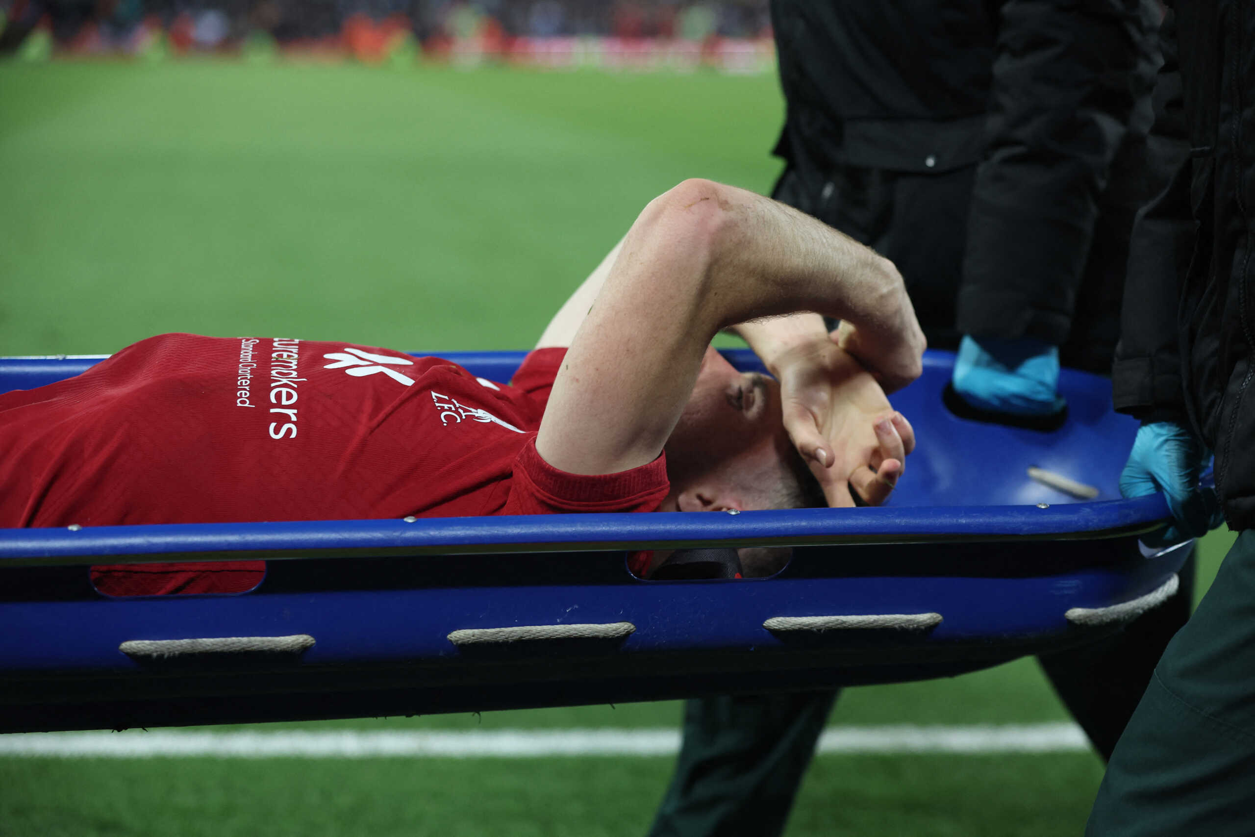 Soccer Football - Premier League - Liverpool v Manchester City - Anfield, Liverpool, Britain - October 16, 2022 Liverpool's Diogo Jota comes off the pitch in a stretcher after sustaining an injury REUTERS