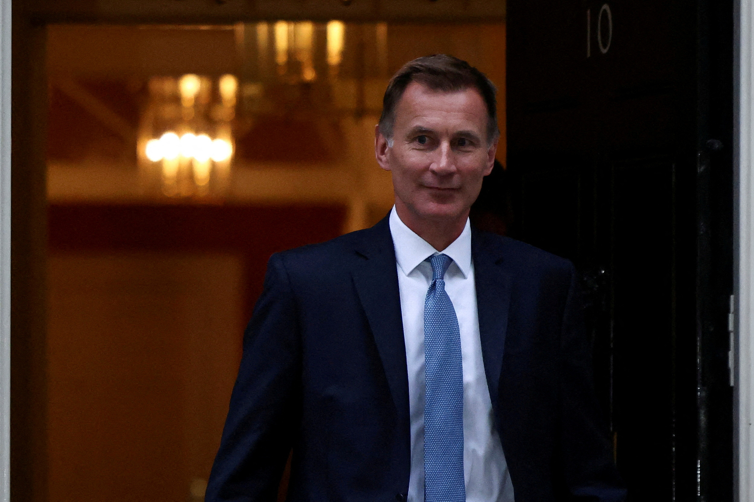 FILE PHOTO: New Chancellor of the Exchequer Jeremy Hunt leaves 10 Downing Street in London, Britain, October 14, 2022. REUTERS