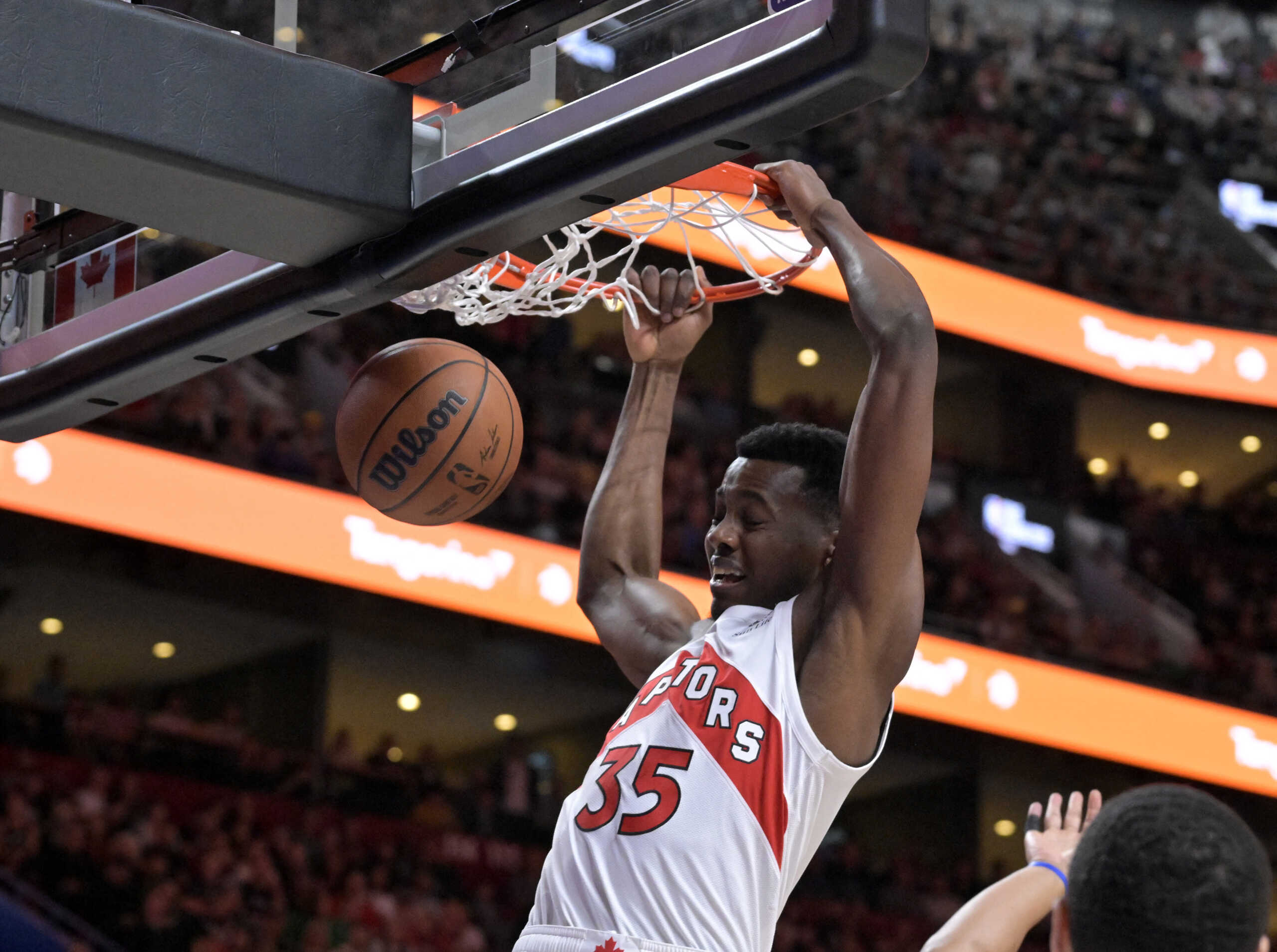 Oct 14, 2022; Montreal, Quebec, CAN; Toronto Raptors center Christian Koloko (35) dunks during the first quarter against the Boston Celtics at the Bell Centre. Mandatory Credit: Eric Bolte-USA TODAY Sports