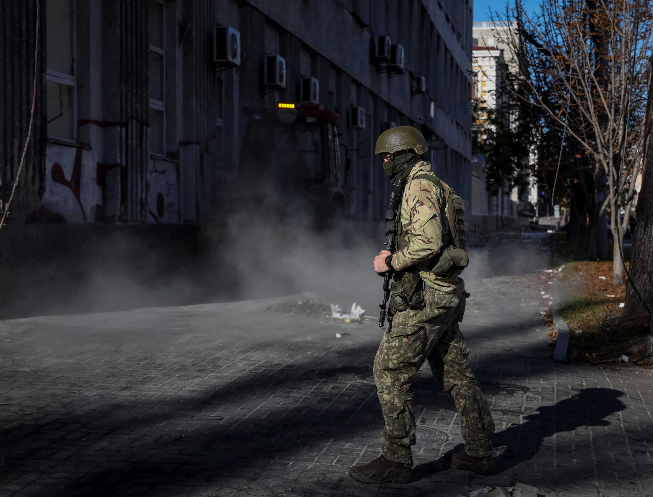 A Ukrainian serviceman patrols the place of morning Russian military strike, as Russia's invasion of Ukraine continues, in central Kyiv, Ukraine October 10, 2022. REUTERS