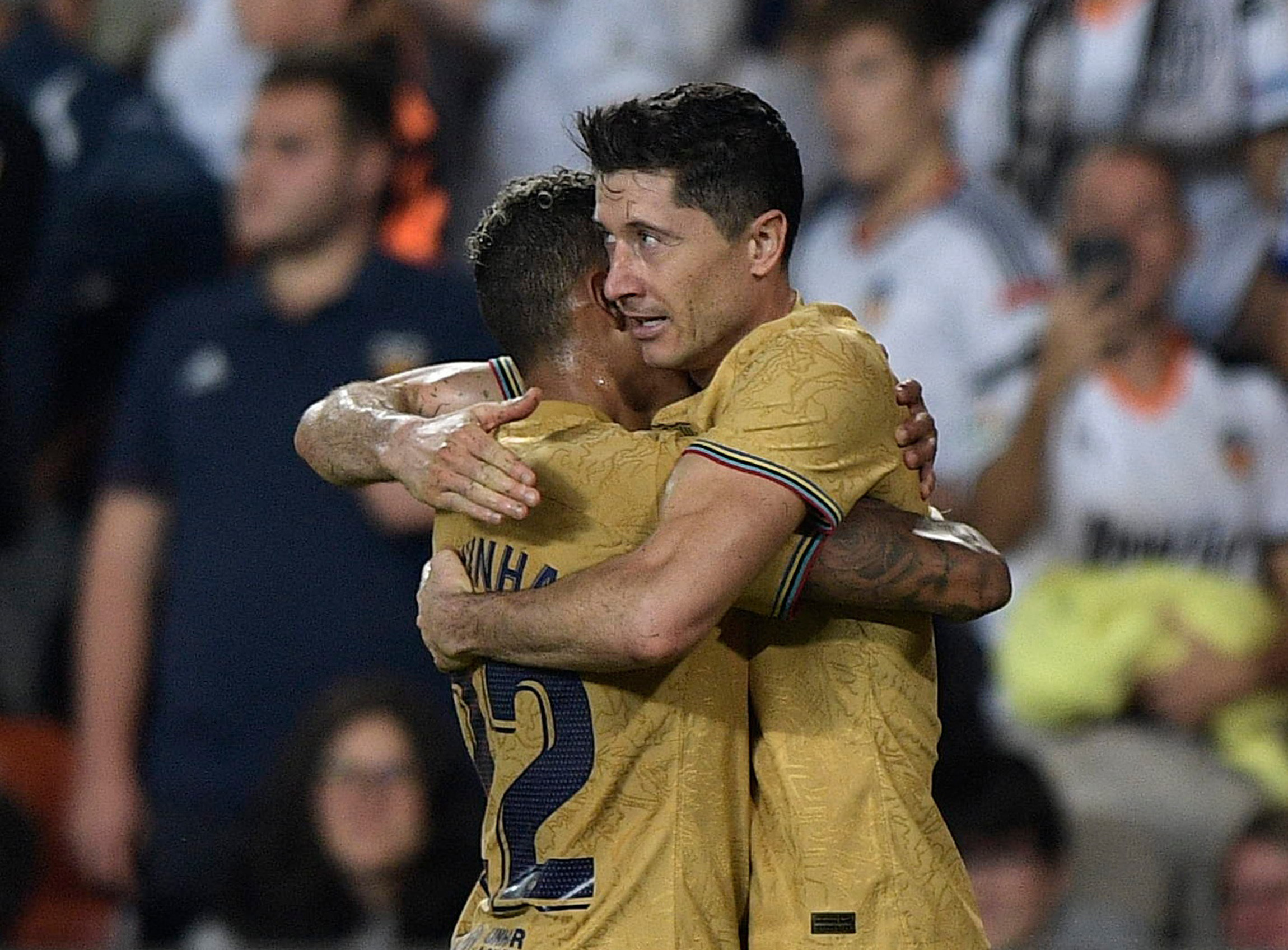 Soccer Football - LaLiga - Valencia v FC Barcelona - Mestalla, Valencia, Spain - October 29, 2022 FC Barcelona's Robert Lewandowski celebrates scoring their first goal with Raphinha REUTERS