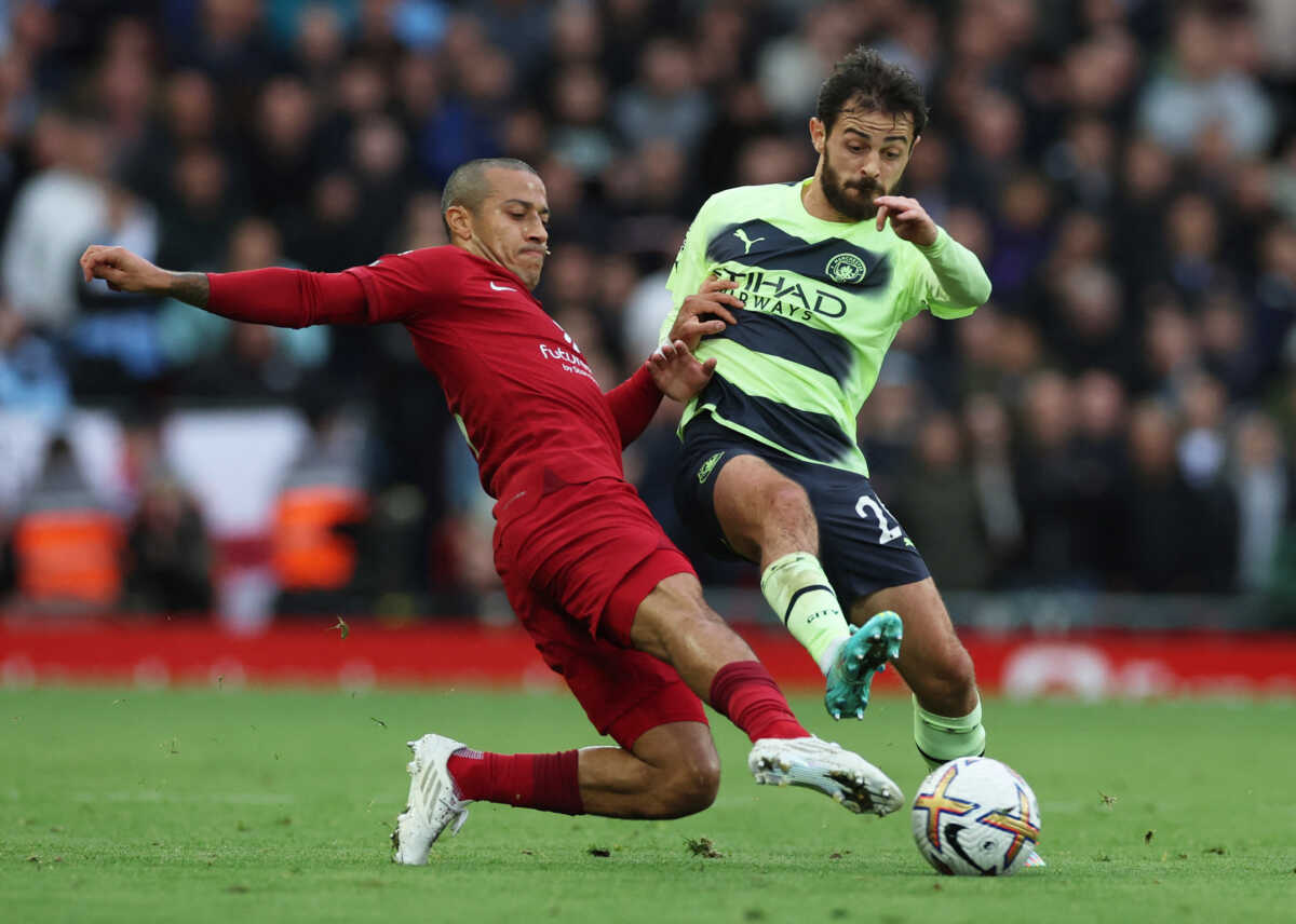 Soccer Football - Premier League - Liverpool v Manchester City - Anfield, Liverpool, Britain - October 16, 2022 Liverpool's Thiago Alcantara in action with Manchester City's Bernardo Silva REUTERS