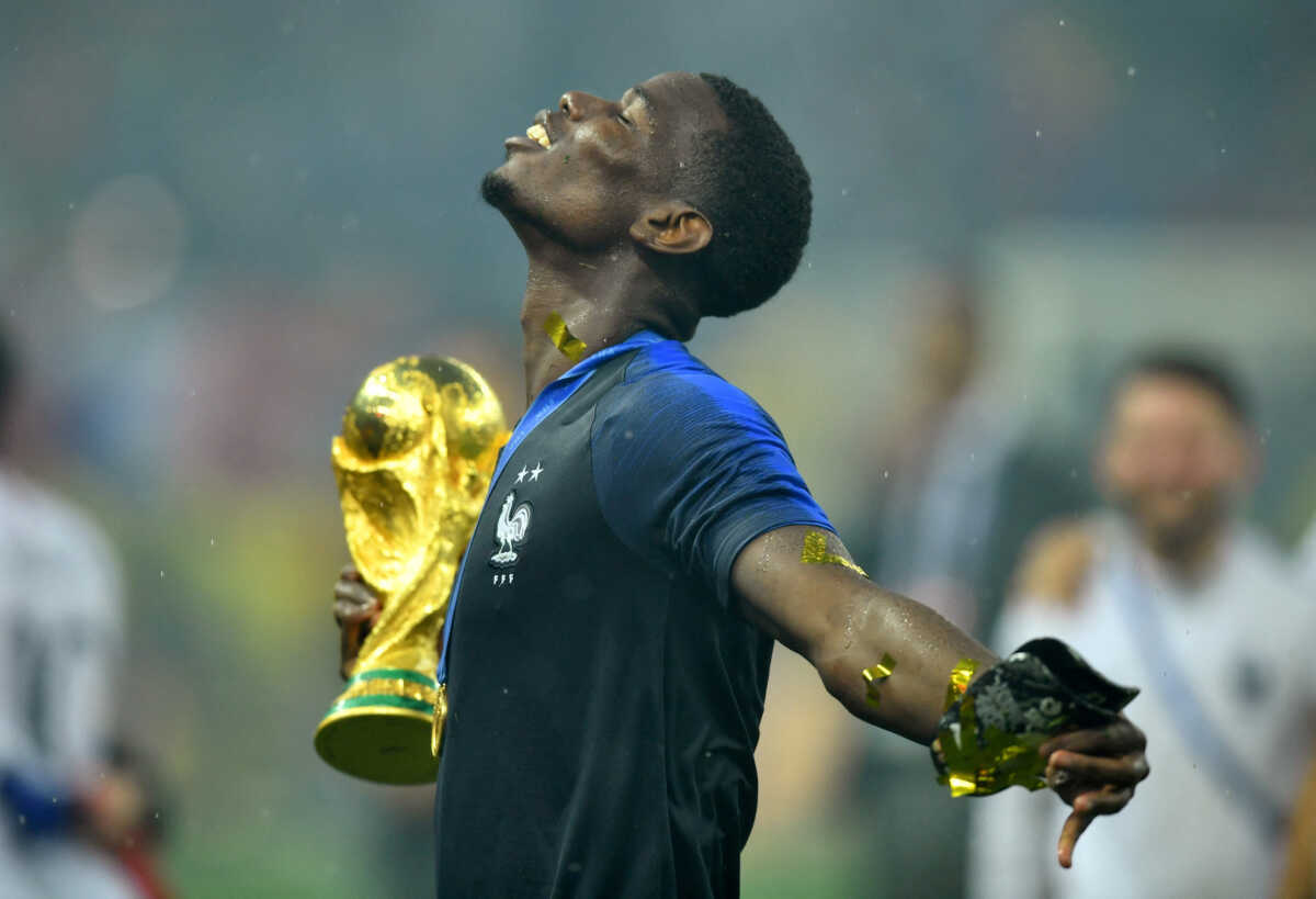 FILE PHOTO: Soccer Football - World Cup - Final - France v Croatia - Luzhniki Stadium, Moscow, Russia - July 15, 2018  France's Paul Pogba holds the trophy as he celebrates winning the World Cup  REUTERS
