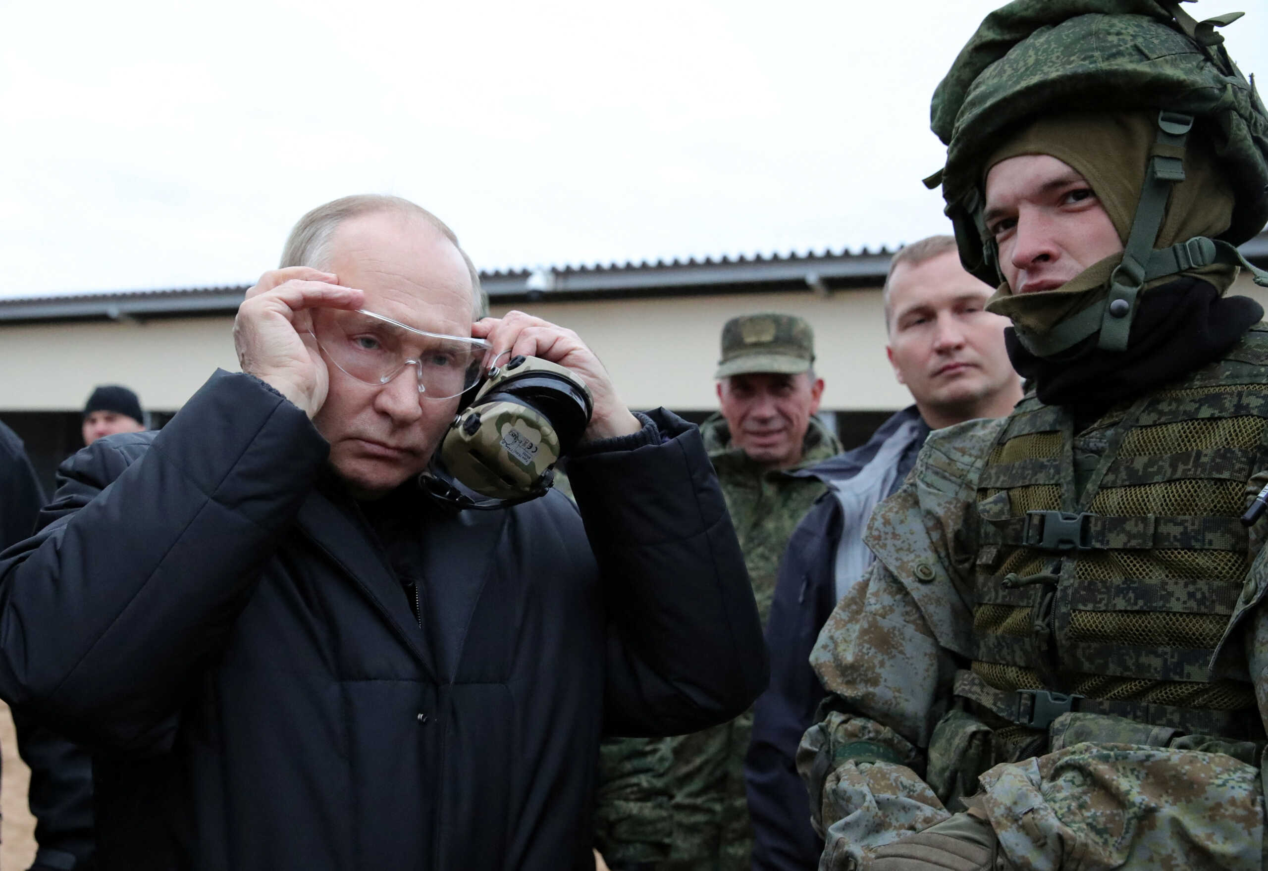 Russian President Vladimir Putin wears glasses as he visits a training centre of the Western Military District for mobilised reservists, in Ryazan Region, Russia October 20, 2022. Sputnik
