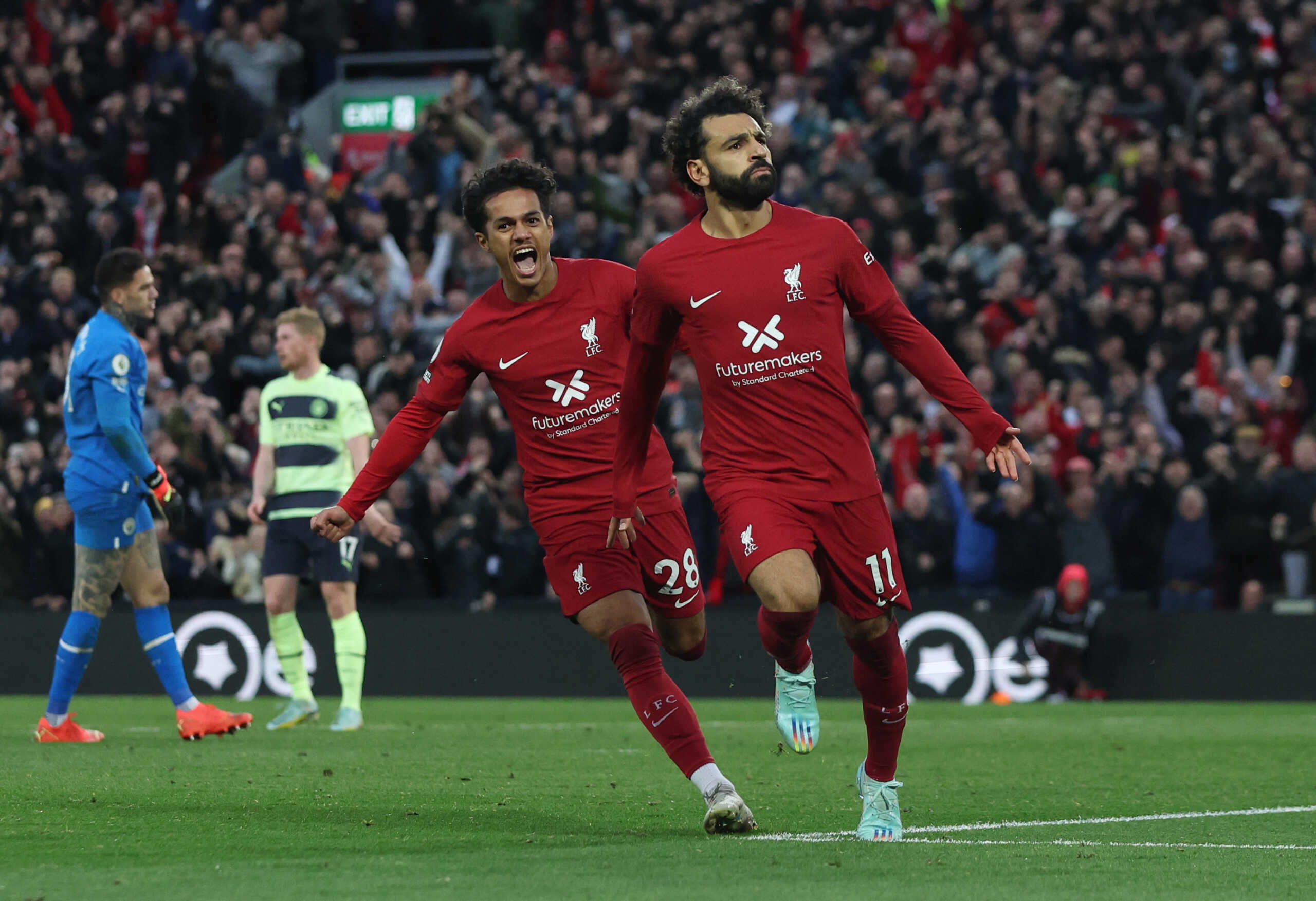 Soccer Football - Premier League - Liverpool v Manchester City - Anfield, Liverpool, Britain - October 16, 2022 Liverpool's Mohamed Salah celebrates scoring their first goal with Fabio Carvalho REUTERS