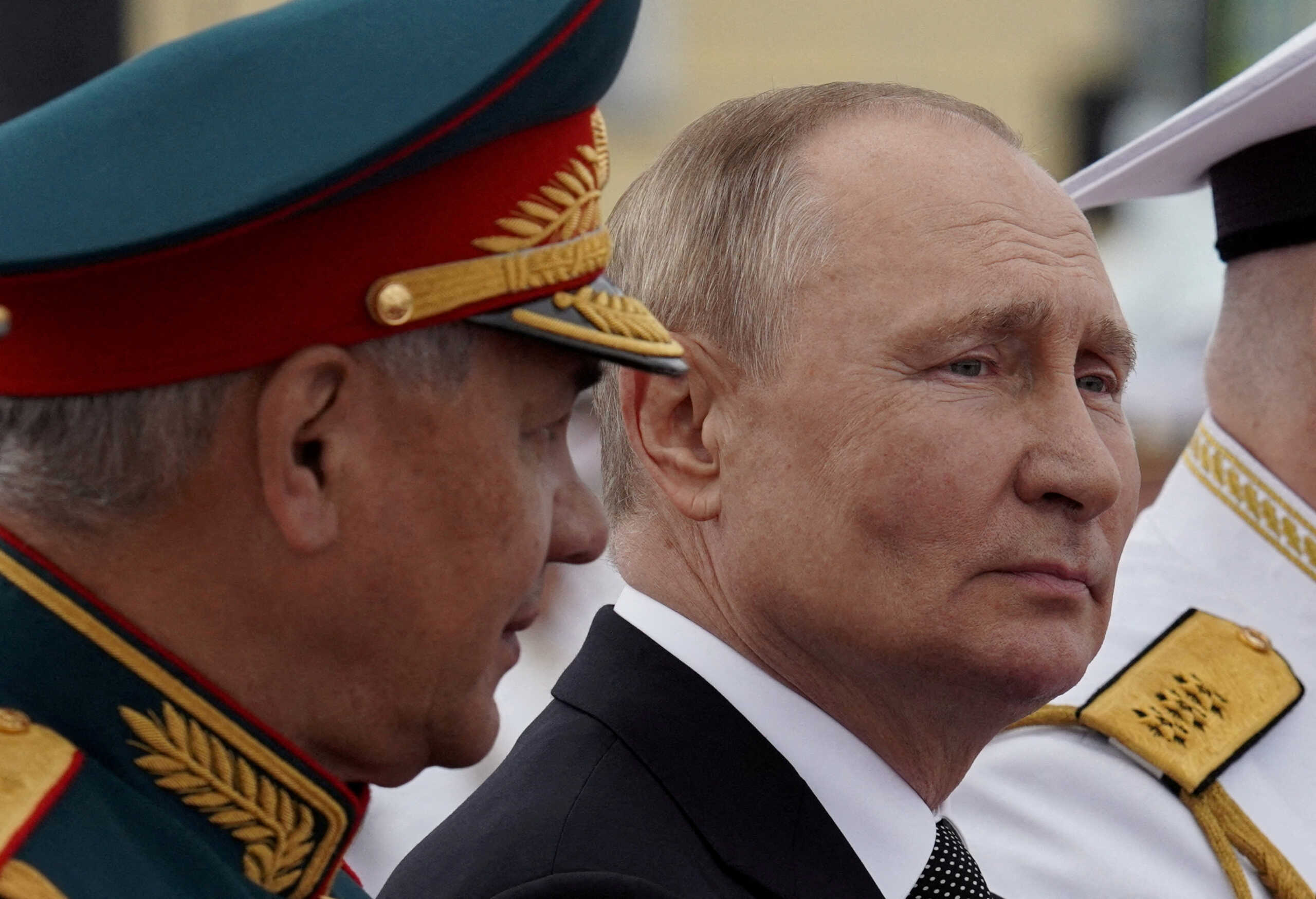 FILE PHOTO: Russia's President Vladimir Putin and Defence Minister Sergei Shoigu attend a parade marking Navy Day in Saint Petersburg, Russia July 31, 2022. Sputnik