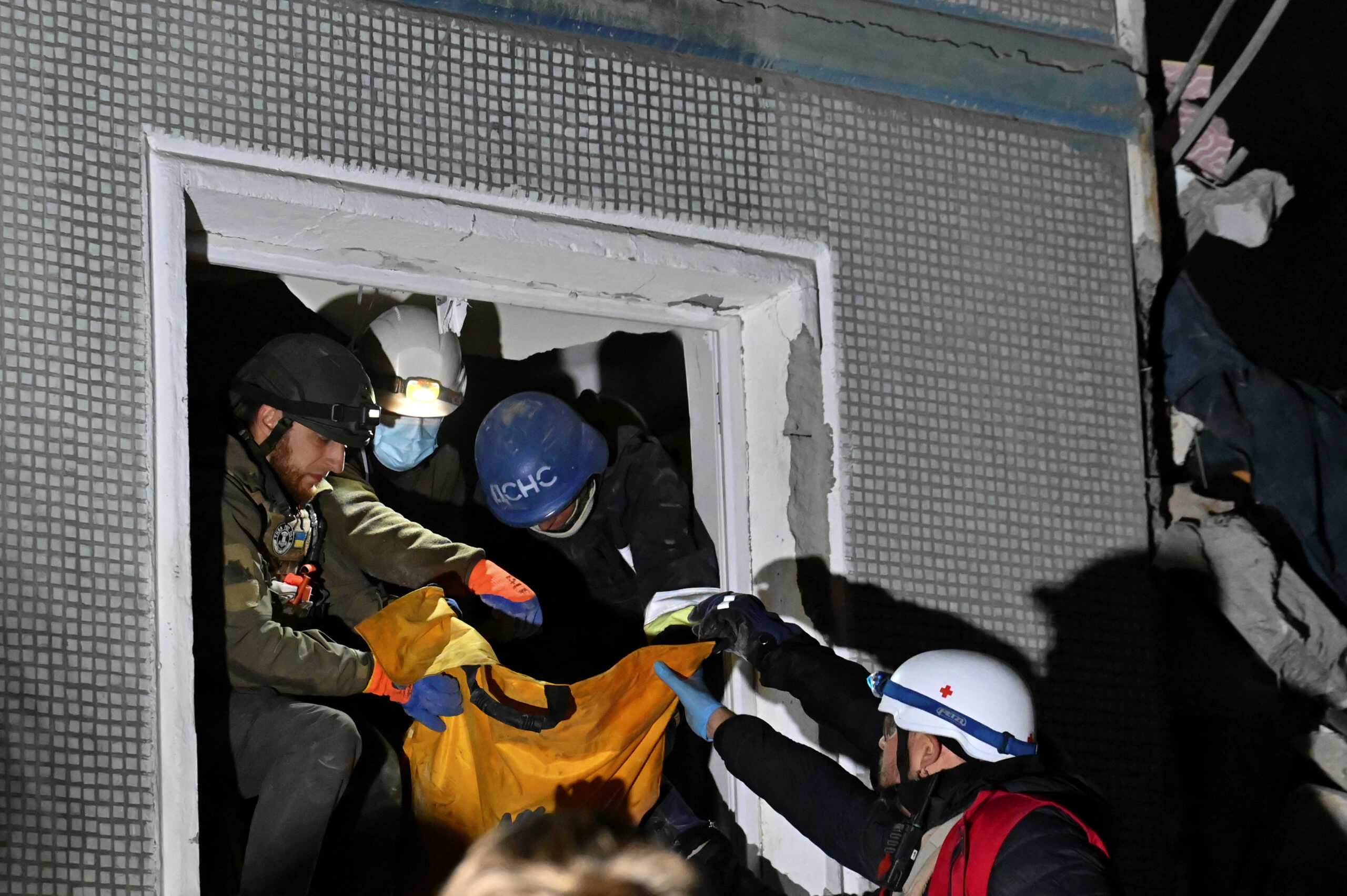 Rescuers carry a person out of a residential building heavily damaged by a Russian missile strike, amid Russia's attack on Ukraine, in Zaporizhzhia, Ukraine October 9, 2022.  REUTERS