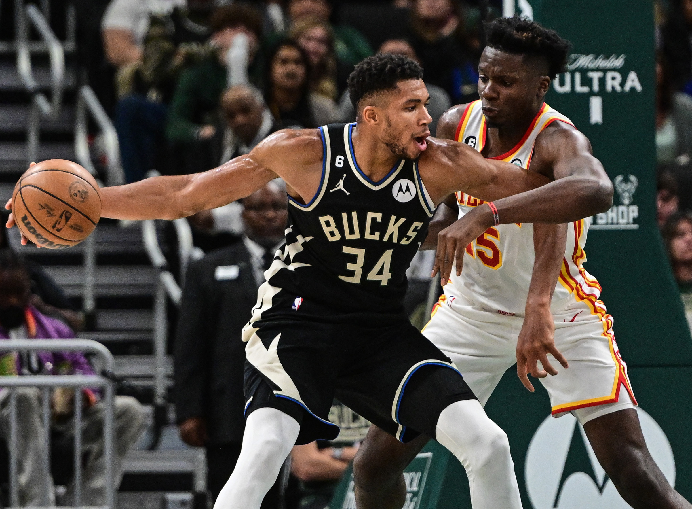 Oct 29, 2022; Milwaukee, Wisconsin, USA; Milwaukee Bucks forward Giannis Antetokounmpo (34) controls the ball against Atlanta Hawks center Clint Capela (15) in the fourth quarter at Fiserv Forum. Mandatory Credit: Benny Sieu-USA TODAY Sports