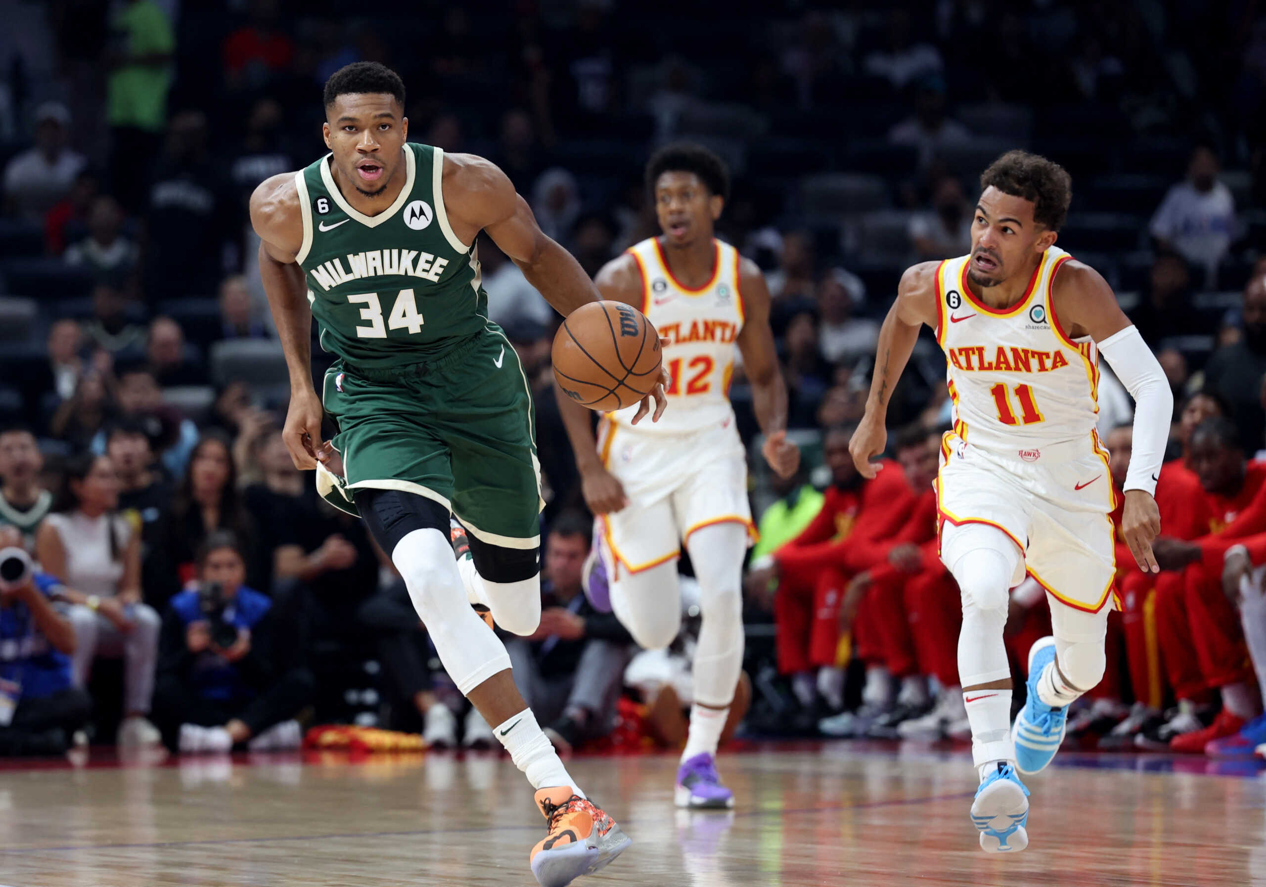 Basketball - NBA Pre-season game - Milwaukee Bucks v Atlanta Hawks - Etihad Arena, Abu Dhabi, United Arab Emirates - October 6, 2022 Milwaukee Bucks' Giannis Antetokounmpo in action with Atlanta Hawks' Trae Young REUTERS