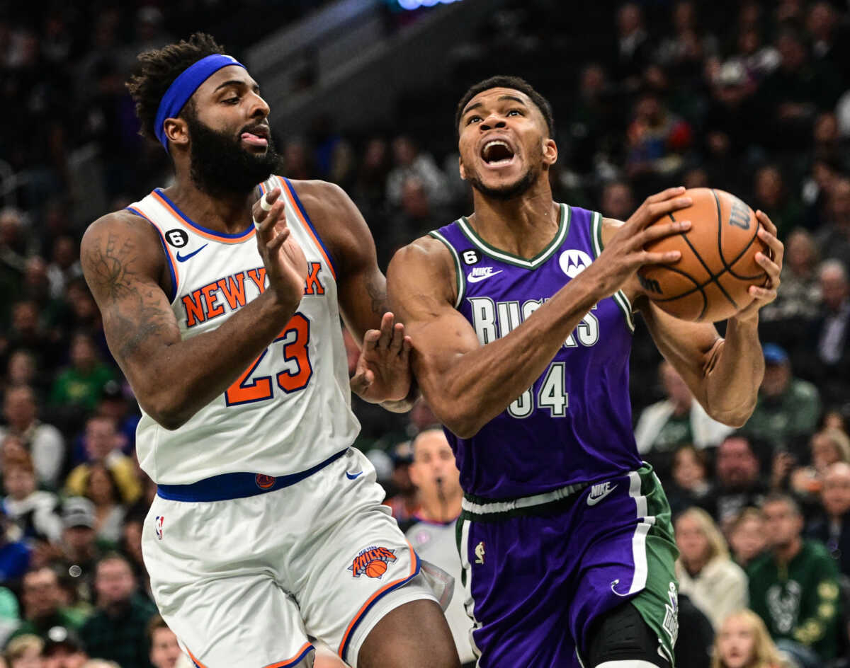Oct 28, 2022; Milwaukee, Wisconsin, USA;  Milwaukee Bucks forward Giannis Antetokounmpo (34) moves to the basket against New York Knicks center Mitchell Robinson (23) in the first quarter at Fiserv Forum. Mandatory Credit: Benny Sieu-USA TODAY Sports