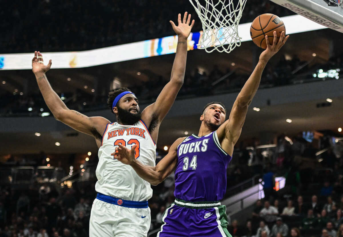Oct 28, 2022; Milwaukee, Wisconsin, USA;  Milwaukee Bucks forward Giannis Antetokounmpo (34) takes a shot against New York Knicks center Mitchell Robinson (23) in the second quarter at Fiserv Forum. Mandatory Credit: Benny Sieu-USA TODAY Sports