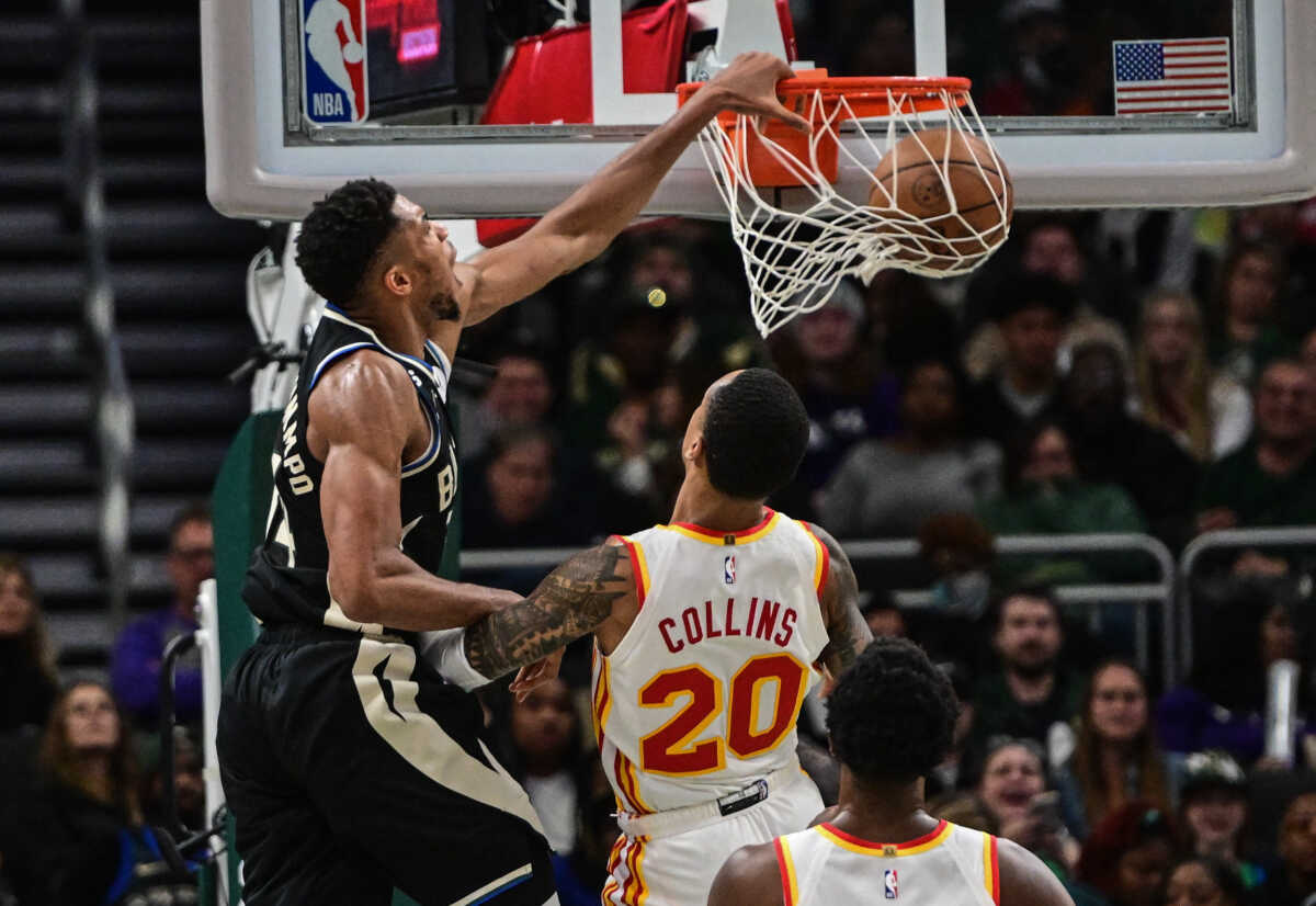 Oct 29, 2022; Milwaukee, Wisconsin, USA; Milwaukee Bucks forward Giannis Antetokounmpo (34) dunks a basket against Atlanta Hawks forward John Collins (20) in the fourth quarter at Fiserv Forum. Mandatory Credit: Benny Sieu-USA TODAY Sports
