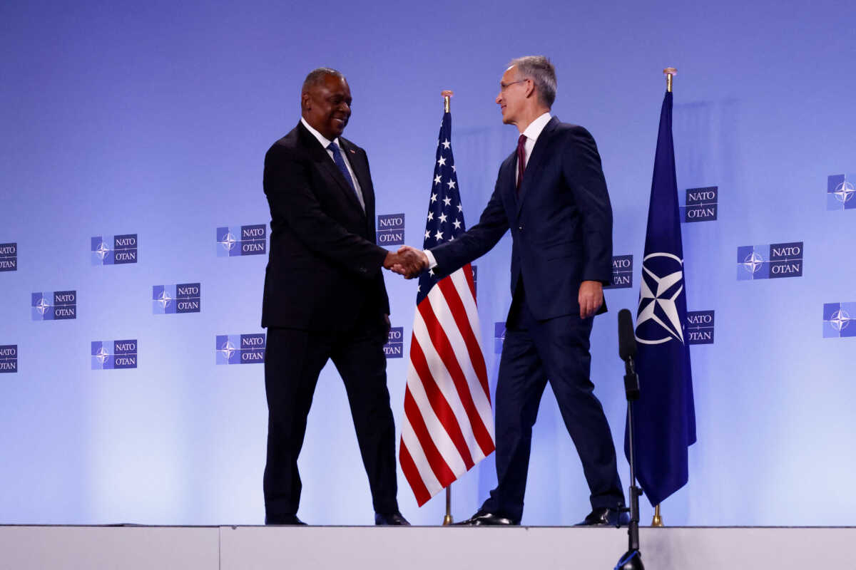 NATO Secretary General Jens Stoltenberg and U.S. Defense Secretary Lloyd Austin shake hands after delivering short remarks during a NATO defence ministers meeting at the Alliance's headquarters, in Brussels, Belgium October 13, 2022. REUTERS