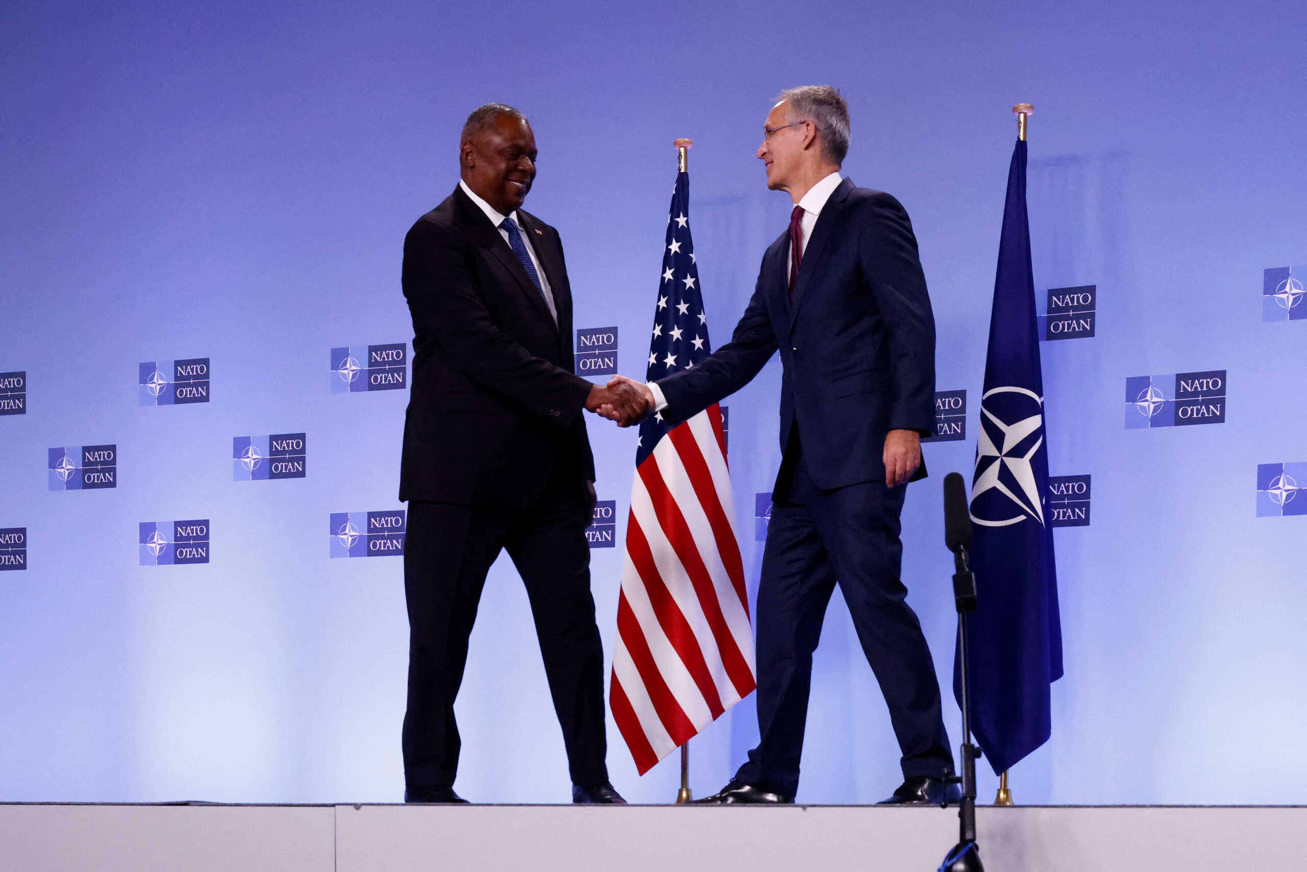 NATO Secretary General Jens Stoltenberg and U.S. Defense Secretary Lloyd Austin shake hands after delivering short remarks during a NATO defence ministers meeting at the Alliance's headquarters, in Brussels, Belgium October 13, 2022. REUTERS