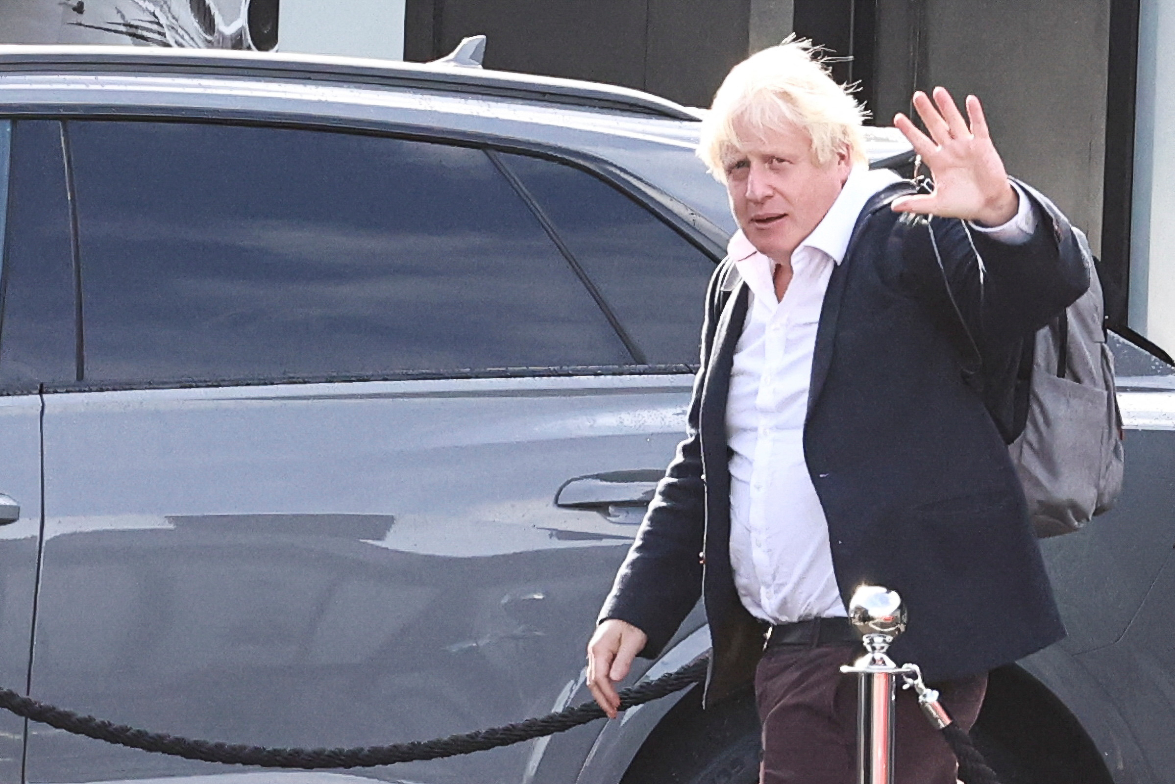 Former British Prime Minister Boris Johnson walks, at Gatwick Airport, near London, Britain October 22, 2022. REUTERS