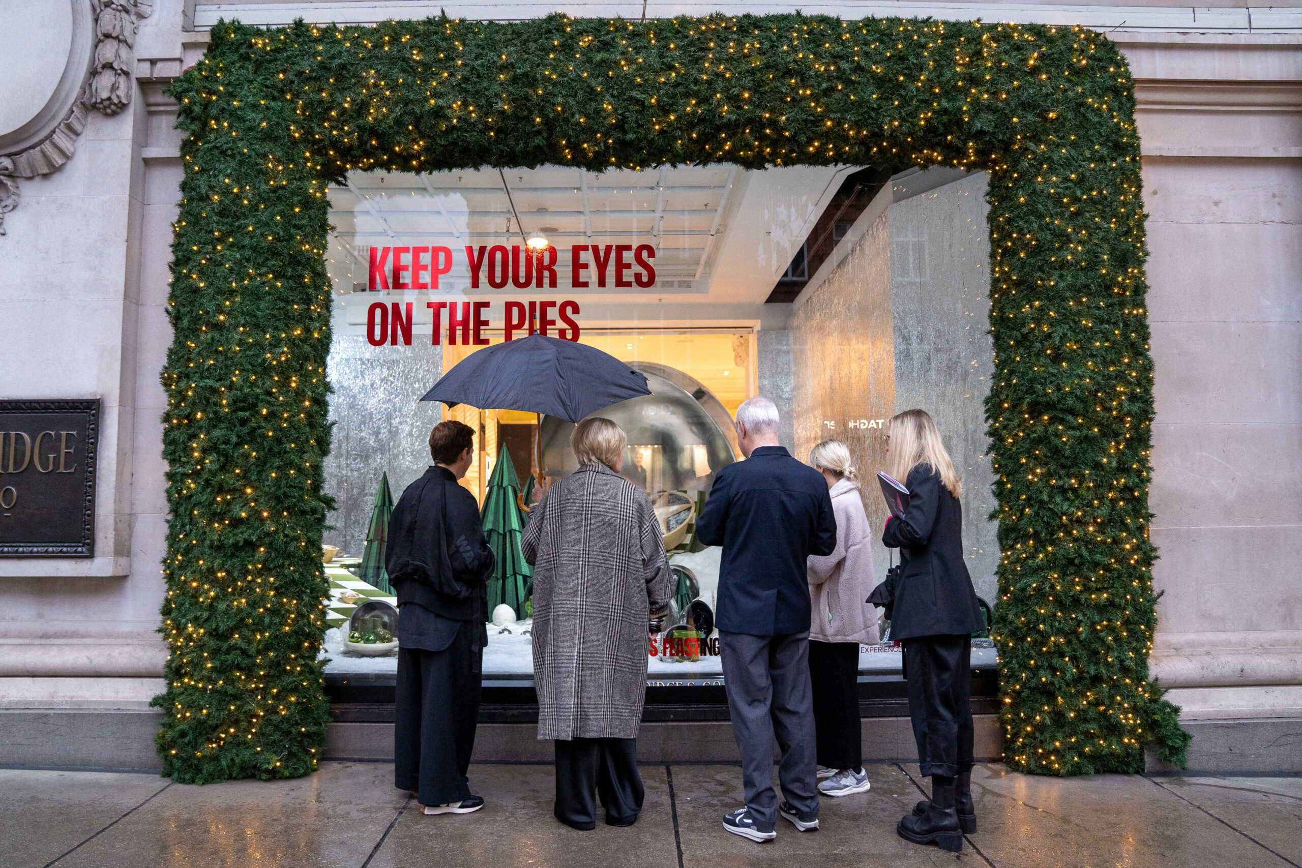 A performer dressed as Santa takes part in the unveiling of Selfridges department store's Christmas window display in London, Britain, October 27, 2022. REUTERS