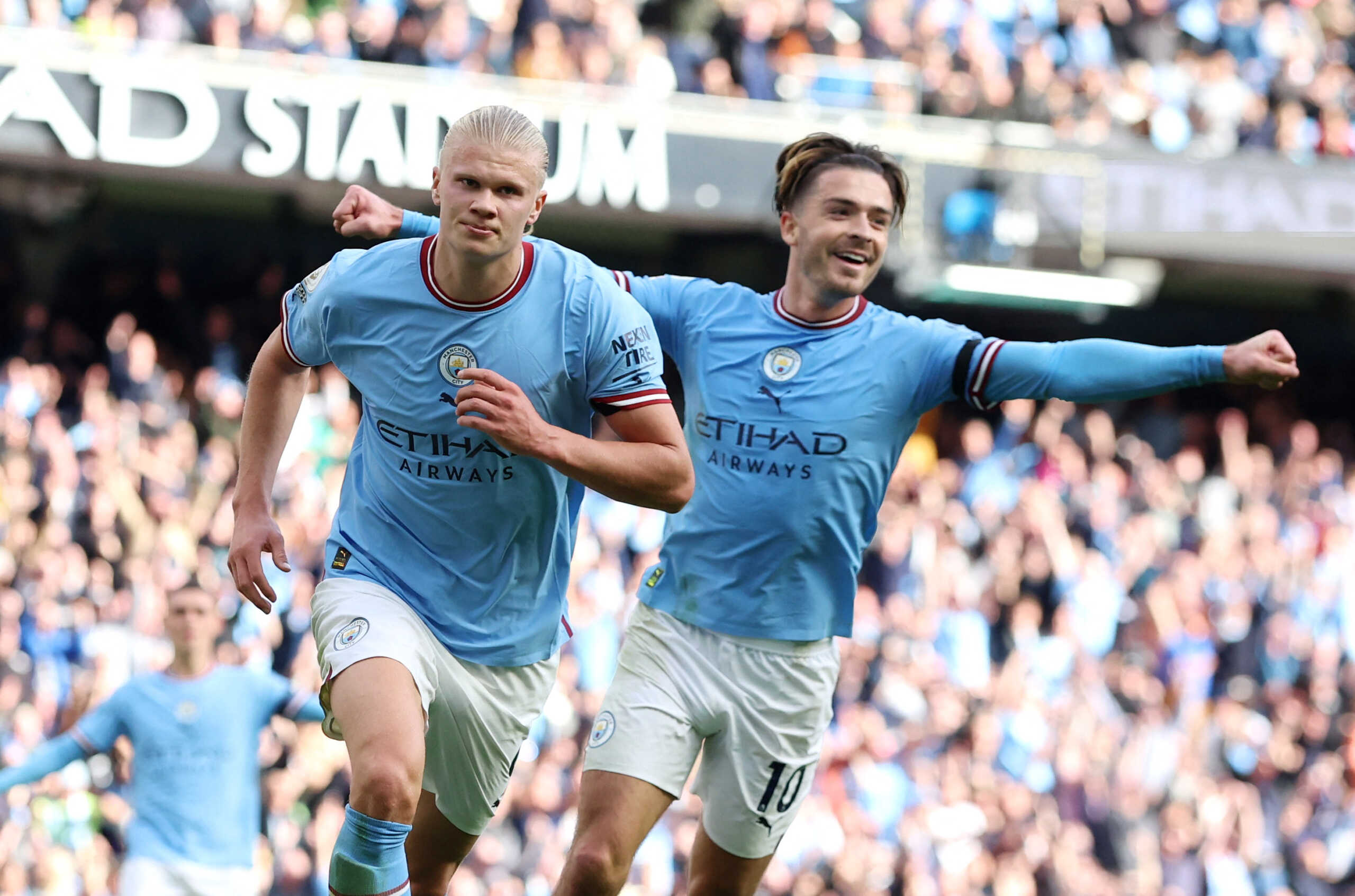 Soccer Football - Premier League - Manchester City v Manchester United - Etihad Stadium, Manchester, Britain - October 2, 2022 Manchester City's Erling Braut Haaland celebrates scoring their fifth goal with Jack Grealish and completing his hat-trick REUTERS