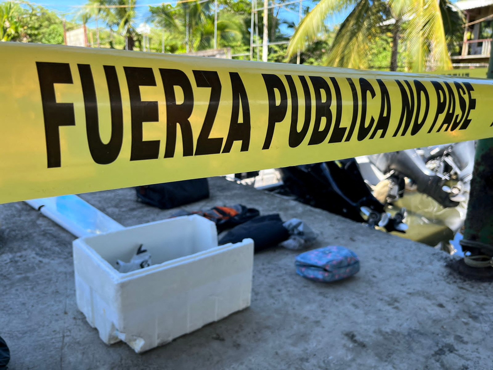 A police cordon is pictured next to remains of a plane and personal belongings at Limon airport after Costa Rican authorities said they found wreckage about 17 miles (28 km) from this airport, Costa Rica October 22, 2022. Ministry of Security