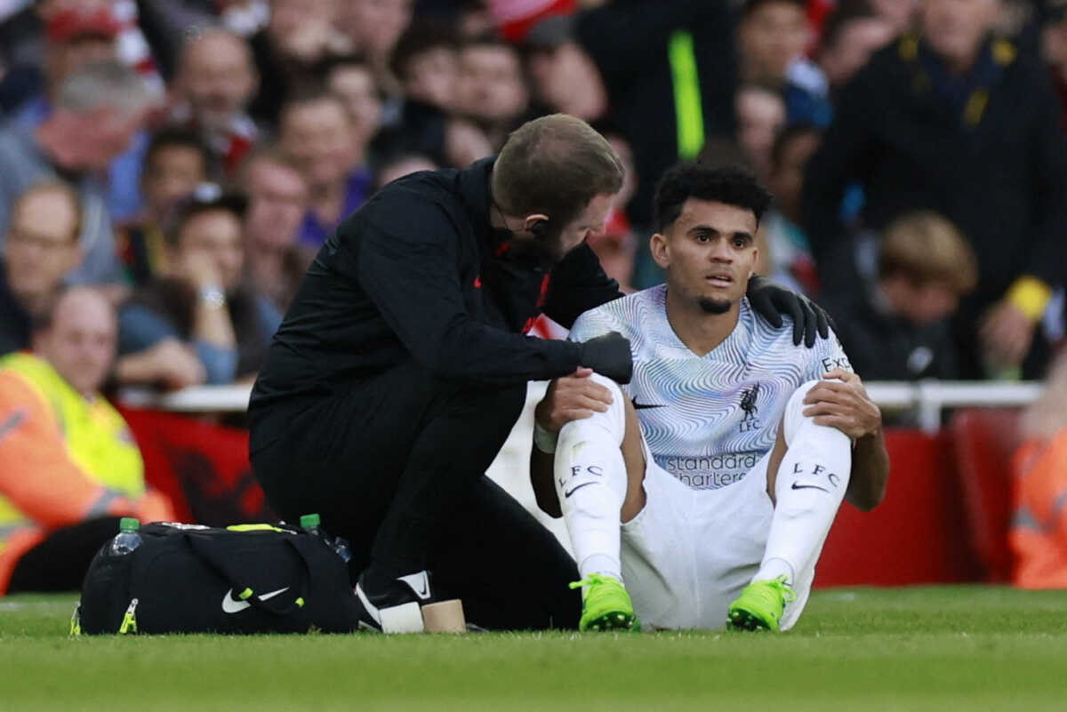 Soccer Football - Premier League - Arsenal v Liverpool - Emirates Stadium, London, Britain - October 9, 2022 Liverpool's Luis Diaz receives medical attention after sustaining an injury Action Images via Reuters